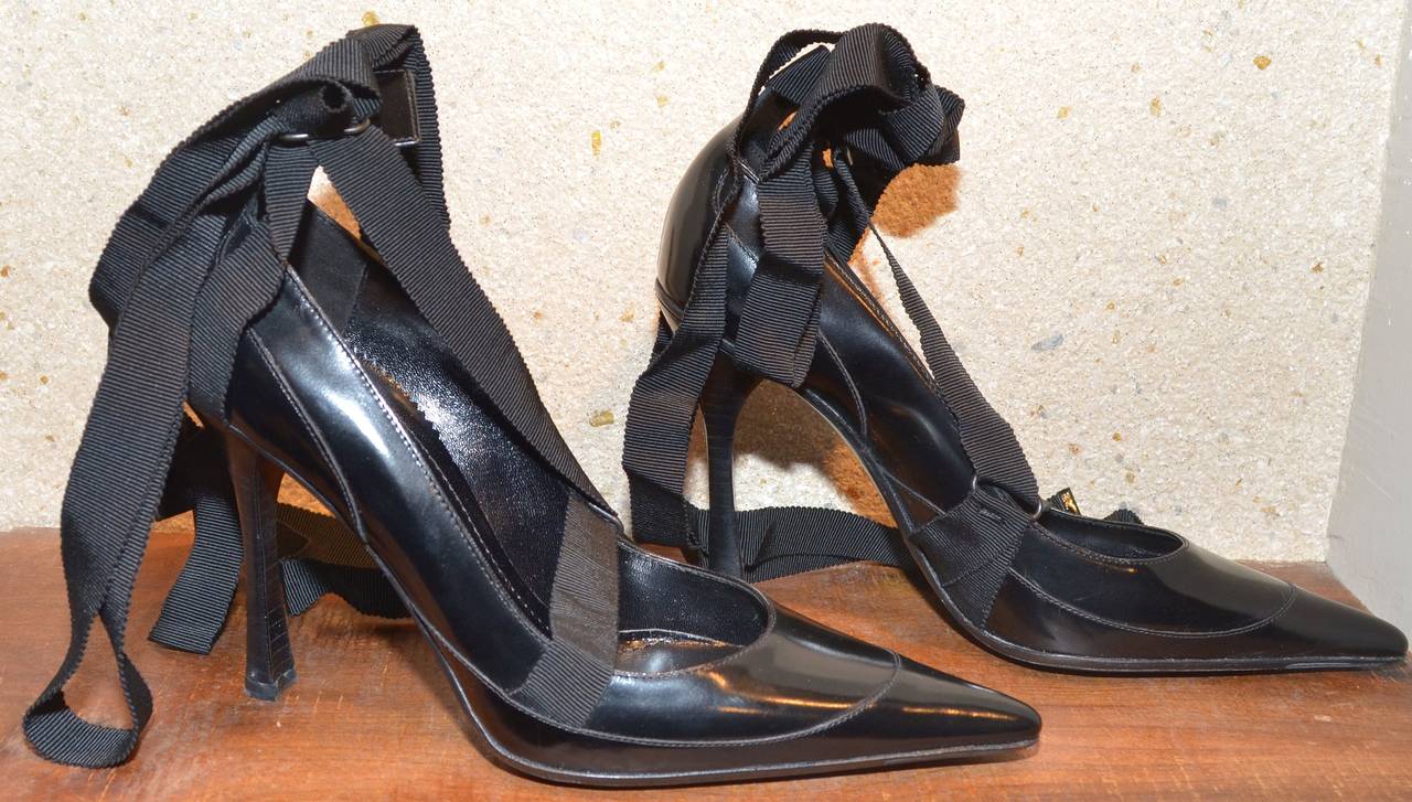 Gucci Tom Ford leather heels are a size 7.5 B. Heels feature a pointy toe style, long ribbon ties with leather-trimmed ends to wrap around the legs/ankles, a 4-inch wood-stacked heel, and leather insoles and soles. 

Measurements:
Heel Height -