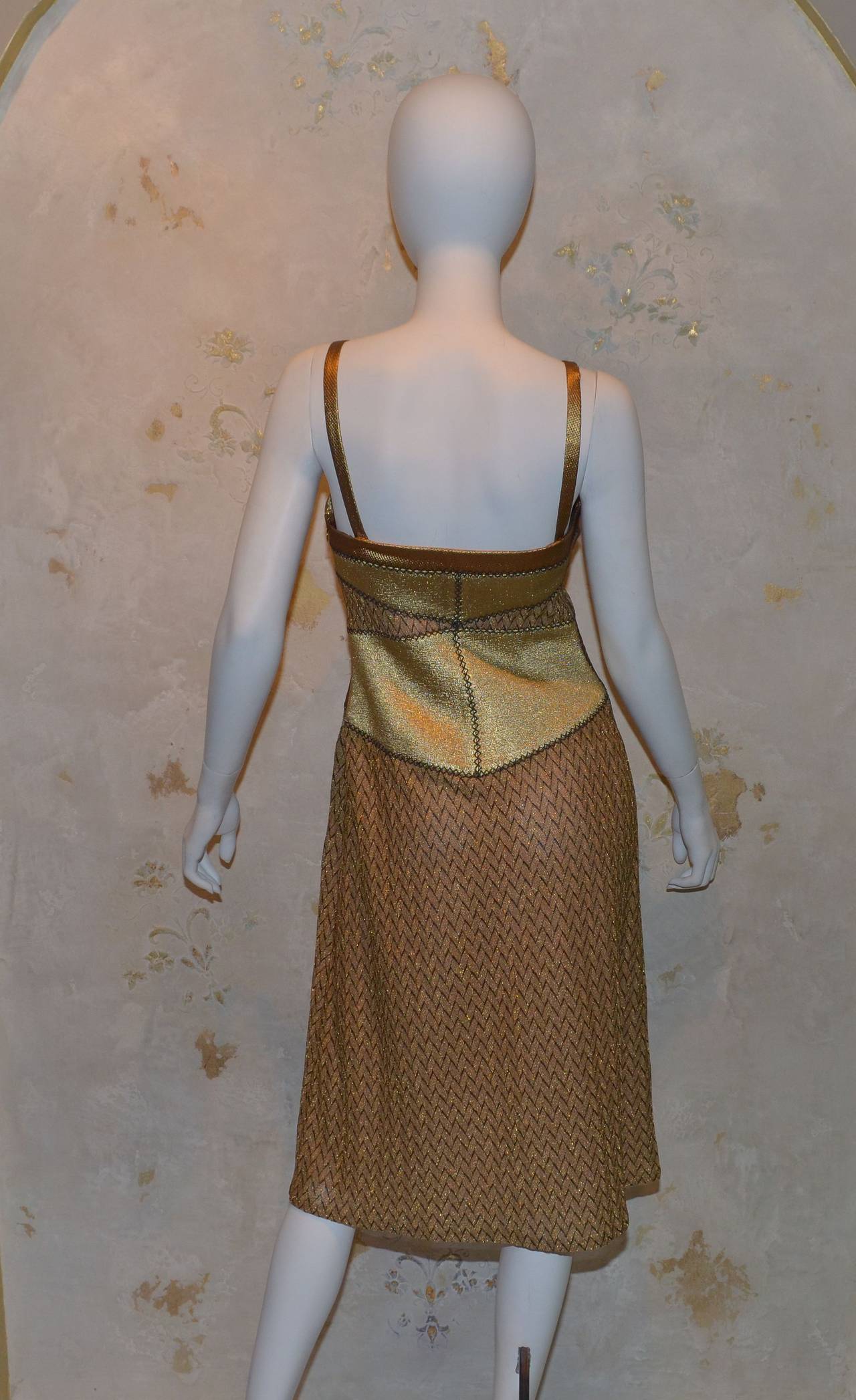 Missoni knit dress made in Italy. Dress is marked a size 42 and has a side zipper closure. Flat shoulder straps are optional and dress can be worn strapless. 61% rayon, 25% rayon cupro, and 14% polyester. Fully lined in 91% silk and 9% elastane.