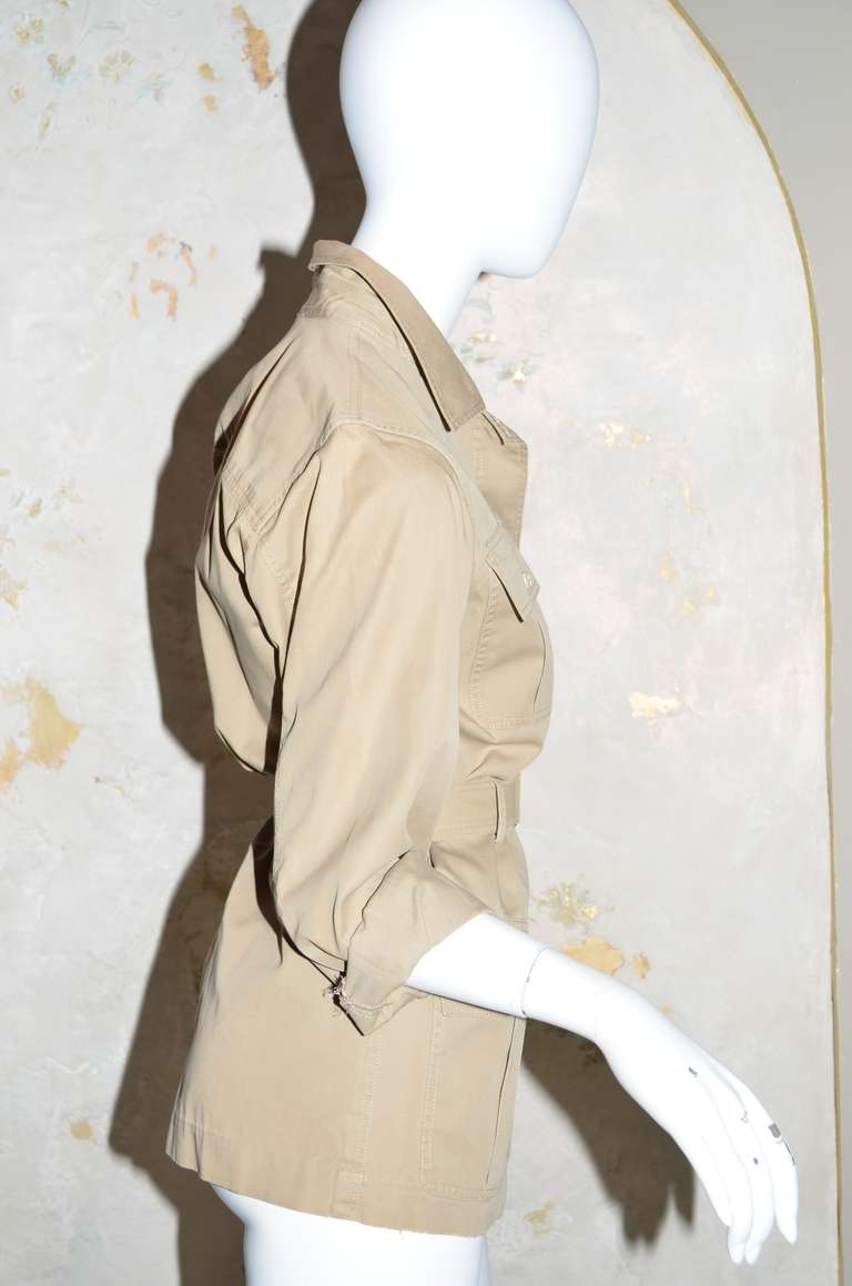 Yves Saint Laurent Rive Gauche Vintage 1970's Safari Jacket
Cotton twill, buttons down front, matching fabric belt with D ring buckle, 4 front pockets, long sleeves with cuff and button.