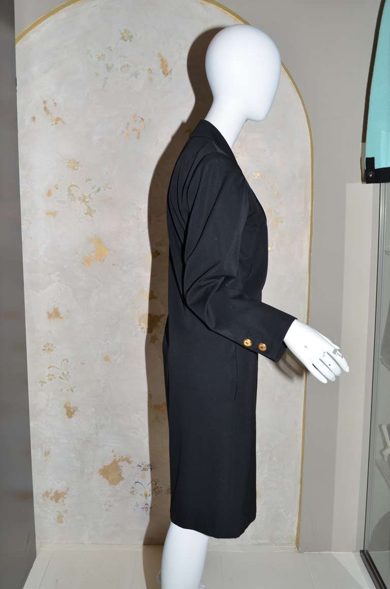 YSL Vintage 1970's / early 1980's tailored double breasted lightweight wool coat or dress. Fully lined, notched collar, gold buttons and black wool. Classic menswear tailoring, with left breast pocket and side seam pockets.