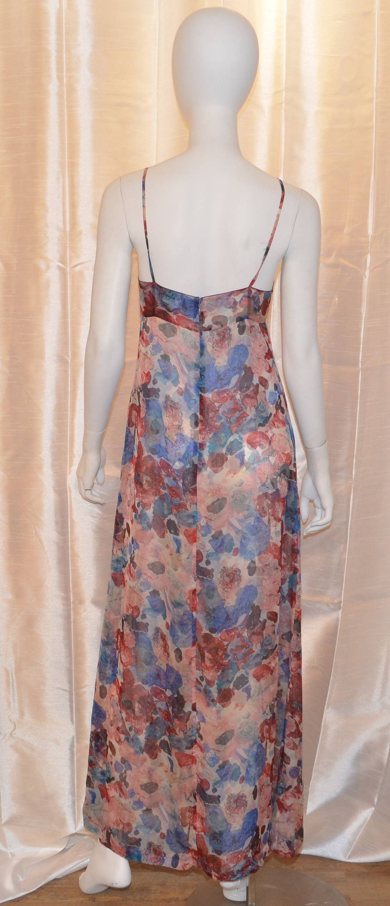 Chanel dress is a size 38 and made in France. There is a back zipper and hook-and-eye fastening, floral print throughout, 100% silk. 

Measurements:
Bust - 32''
Waist - 31''
Hips - 39''
Length - 56.5''