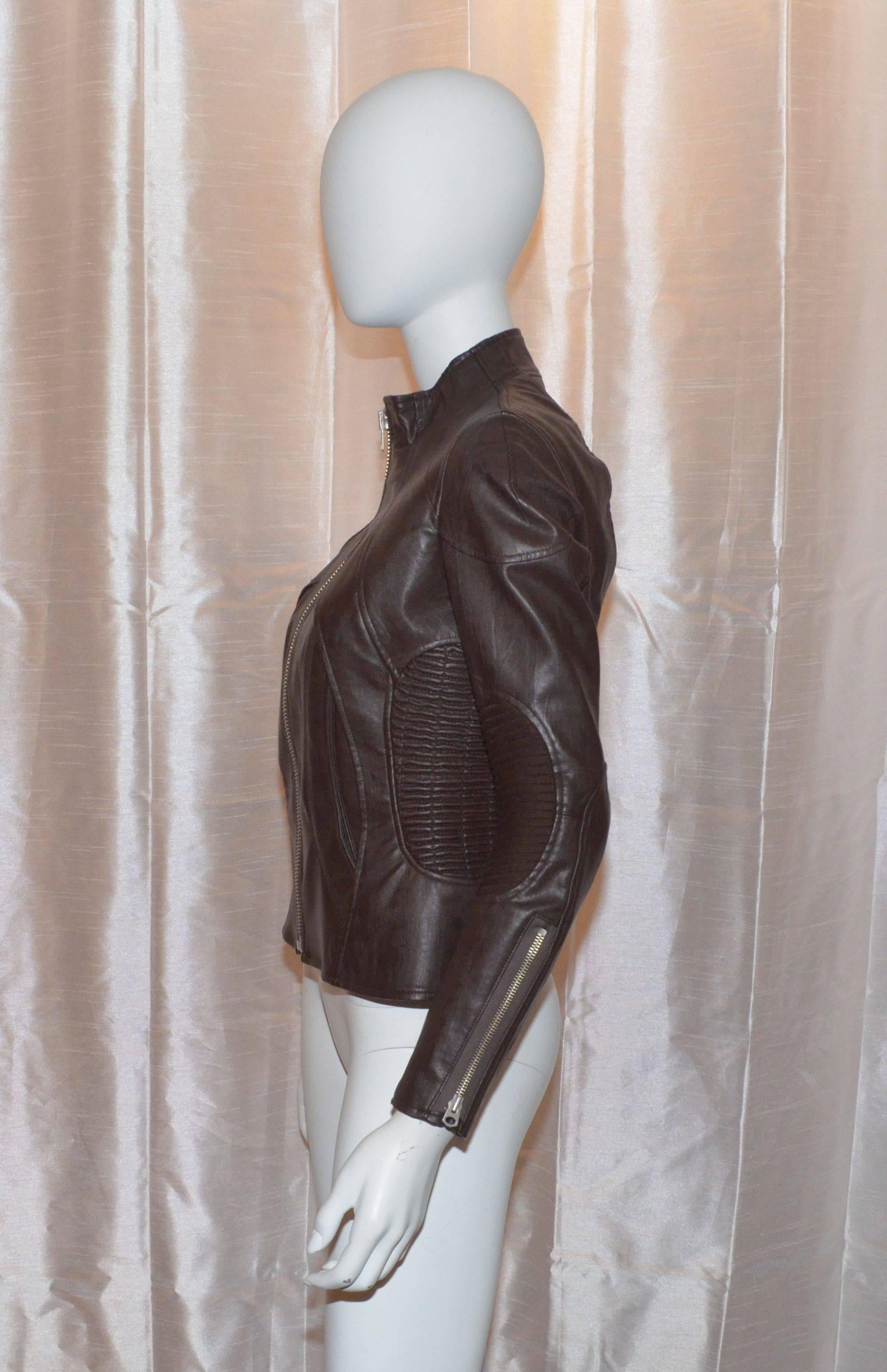 Jacket is made with 100% vegan leather, front zipper closure, ribbed stretchy side panels, ribbed elbow patches, and zippers on the cuffs. Jacket is fully lined and is made in Japan. Size M.

Measurements:
Bust - 34''
Sleeves - 23''
Shoulder to