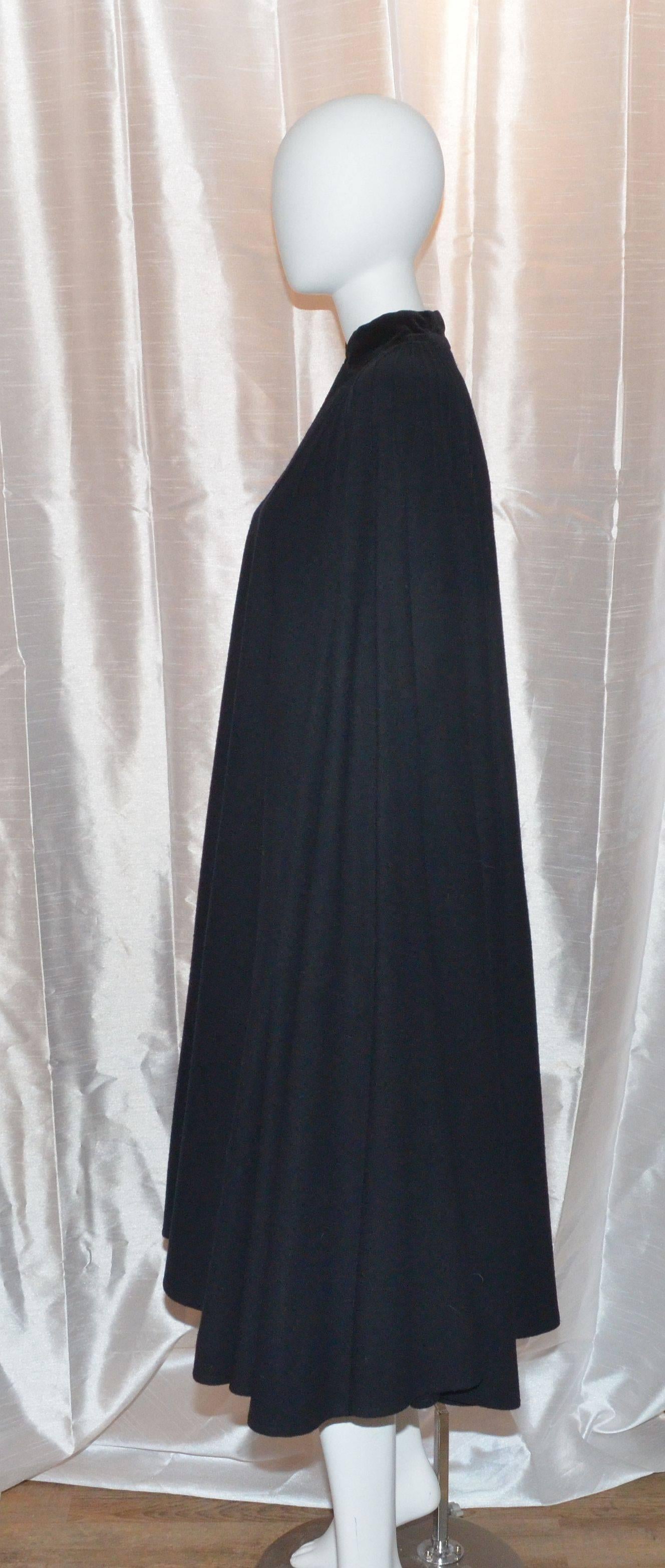 Valentino Vintage Miss V Black Wool Cape & Velvet Nehru Collar Pin Tuck Yoke

Vintage Valentino Miss V Wool Cape features black button closures with rhinestone jewels at the center, and velvet  trimming along the neck collar. Cape is made with 53%