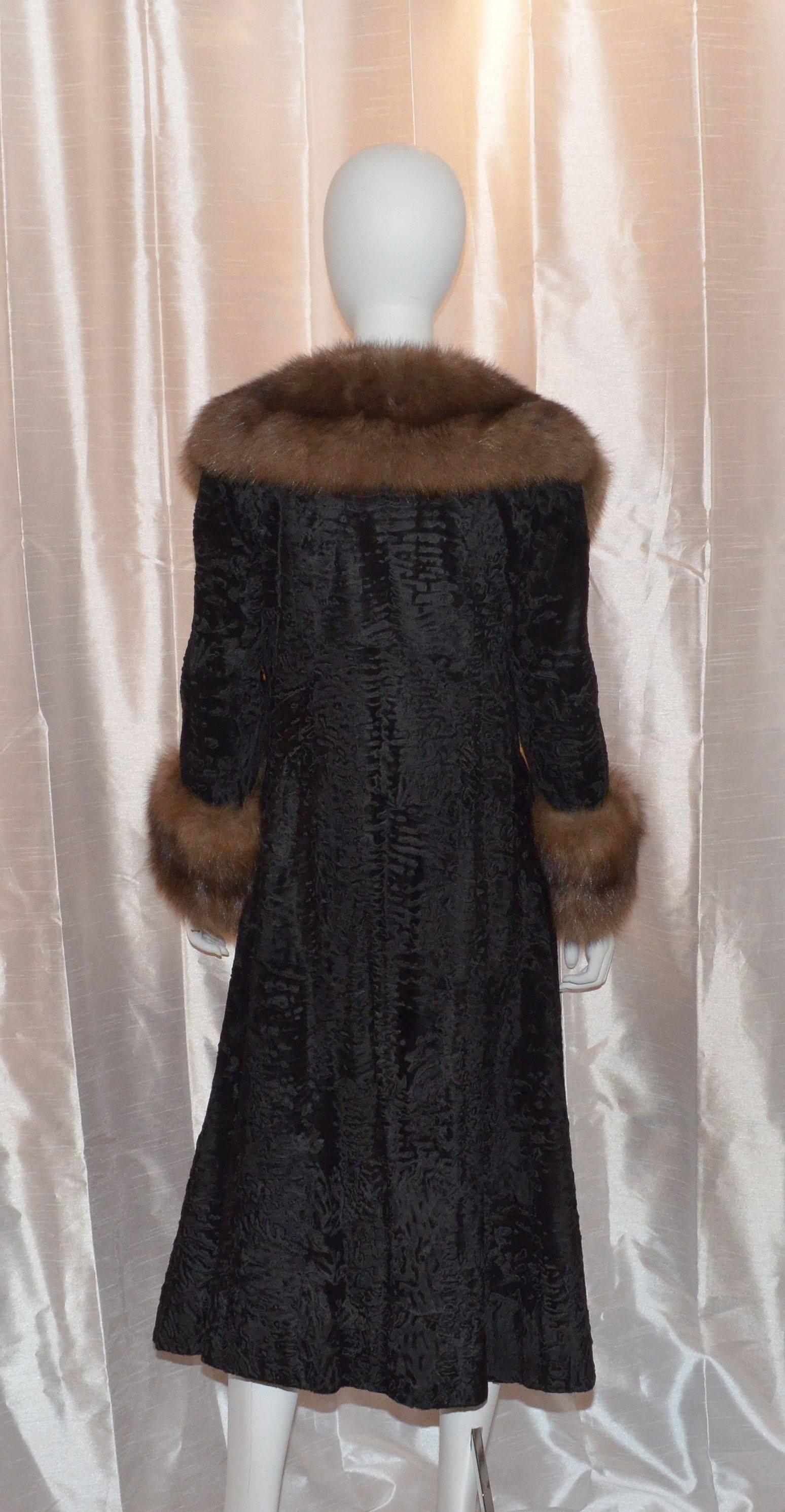 Gorgeous Christian Dior broadtail coat with a Sable fur collar and cuffs, two pockets at the hips, fully lined. Hook-and-eye closure at the front center. Excellent condition.

Measurements:
Bust - 36''
Waist - 35''
Sleeve Length - 23''
Length - 45''