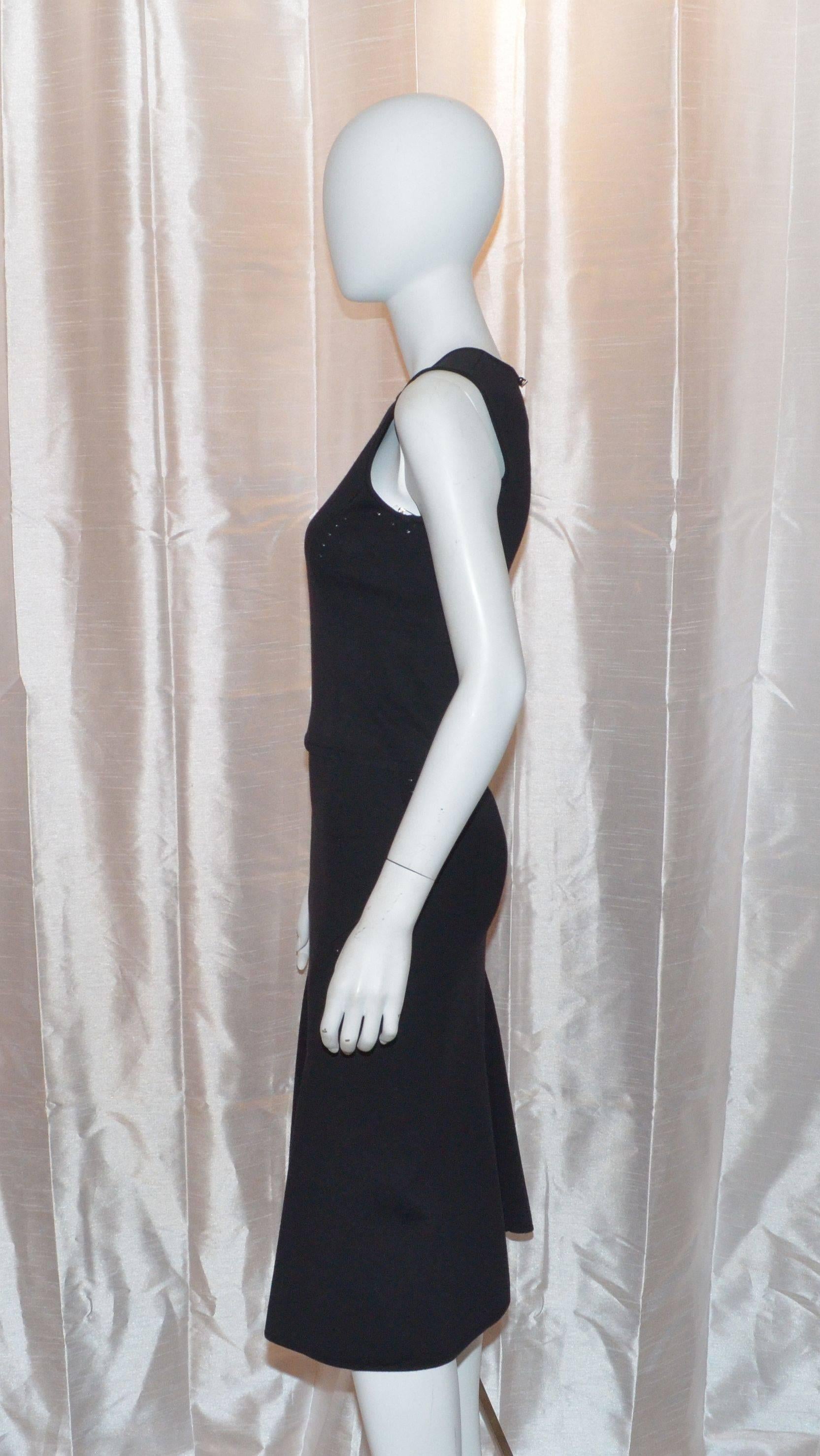 Gianni Versace Vintage Black Wool Knit Cropped Tank and Midi Skirt Ensemble Set

Gianni Versace skirt set features a body con knit shell and skirt. Shell has a button closure at the back of the neck. Skirt is stretchy with an elasticized waistband