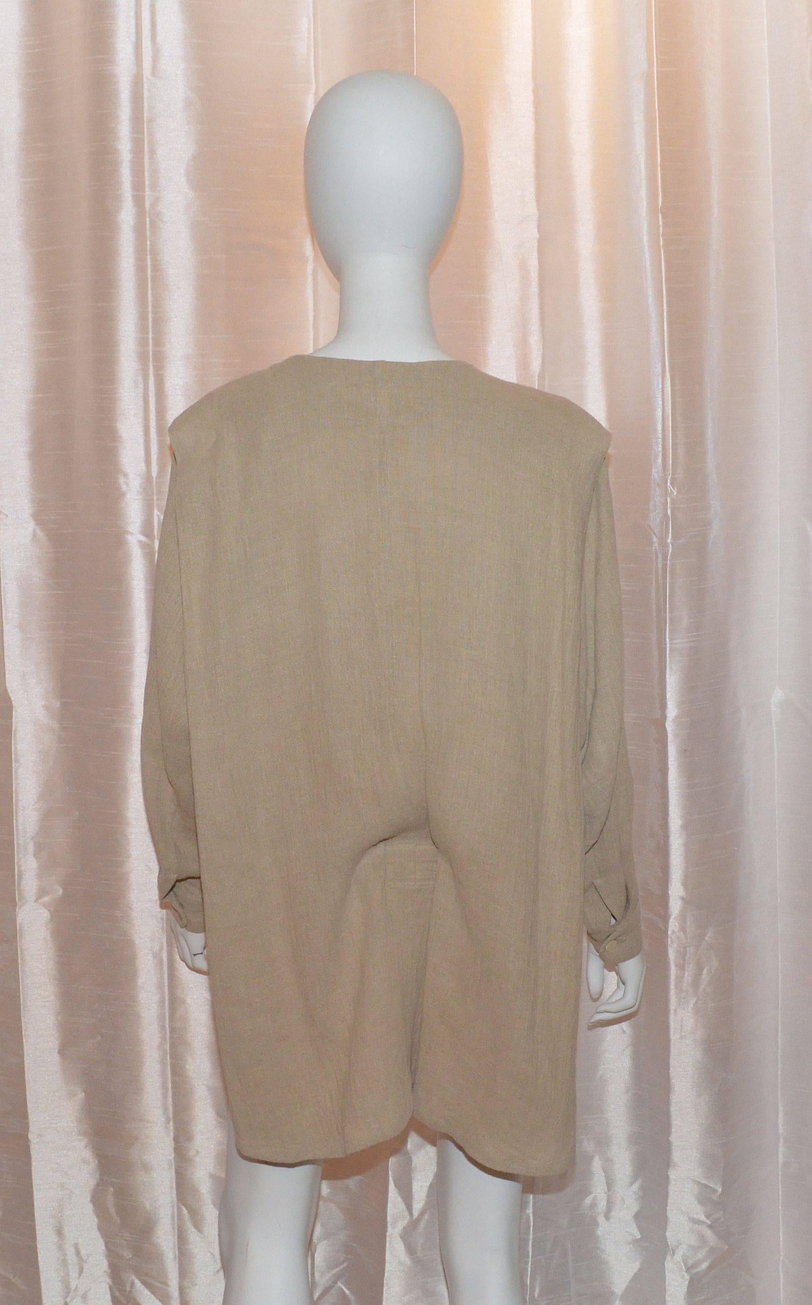 Vintage Issey Miyake jacket is a size S, made in Japan, and 100% linen. Jacket is short in the front and long in the back. Draped design. There are button closures along the front and on the cuffs, drawstrings at the front hem, and a vertical pocket