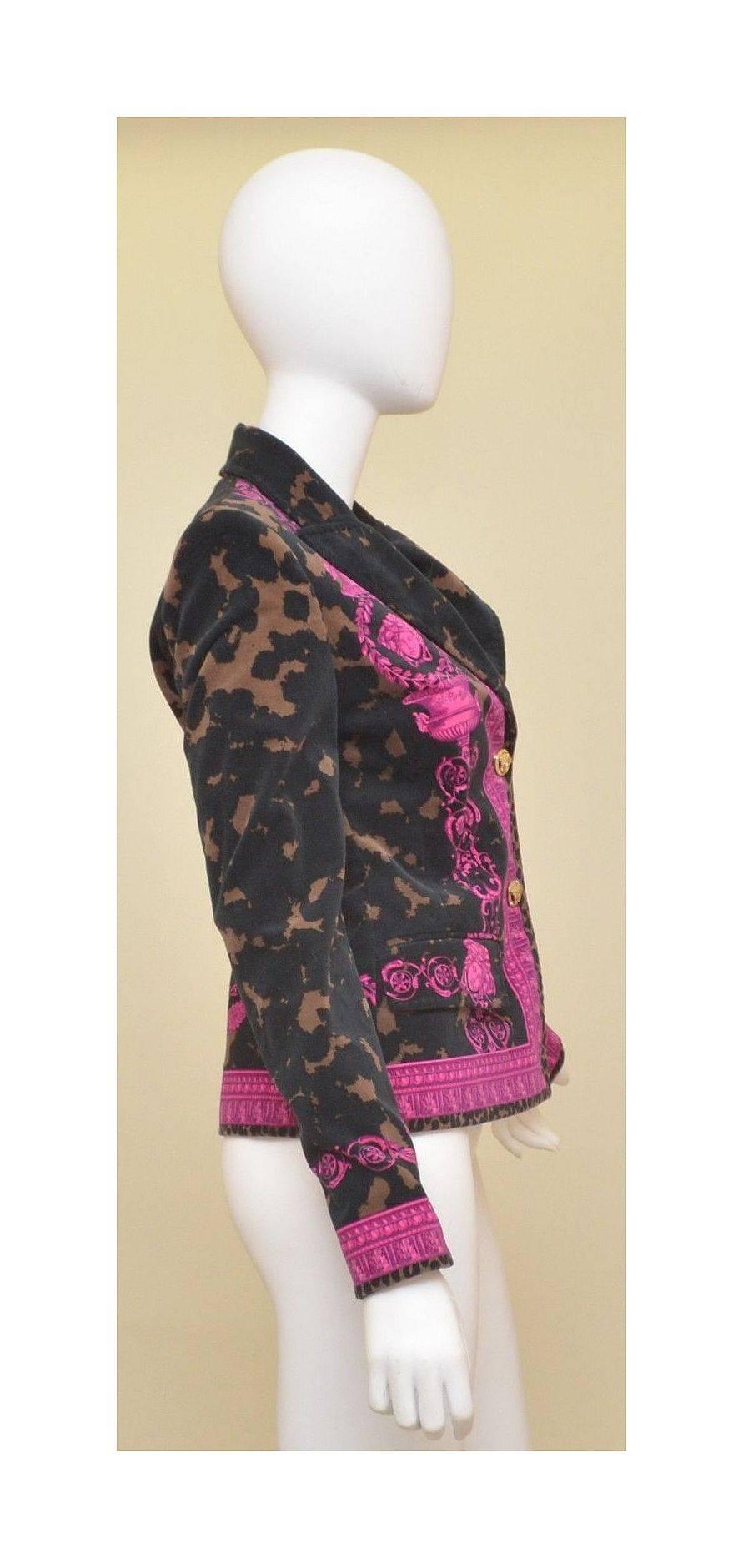 Versace Jacket is an Italian size 42, US 8. Features black, brown, and fuchsia velvet, gold-tone Medusa head button closures, Medusa print throughout, and two front flap pockets. Jacket is fully lined and in EXCELLENT condition!

Measurements: