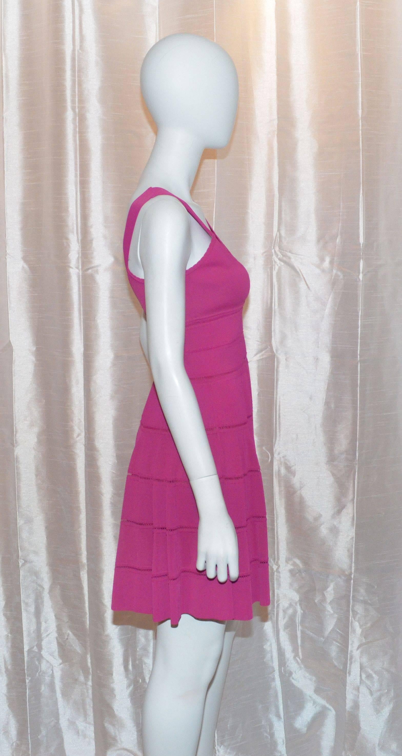 Christian Dior dress is made with 94% viscose, 5% polyamide, and 1% elastane; Double lining is made with 90% viscose and 10% lycra. Made in Italy, size 8. Dress has a concealed zipper fastening along the side of the bodice. Stretch fabric with