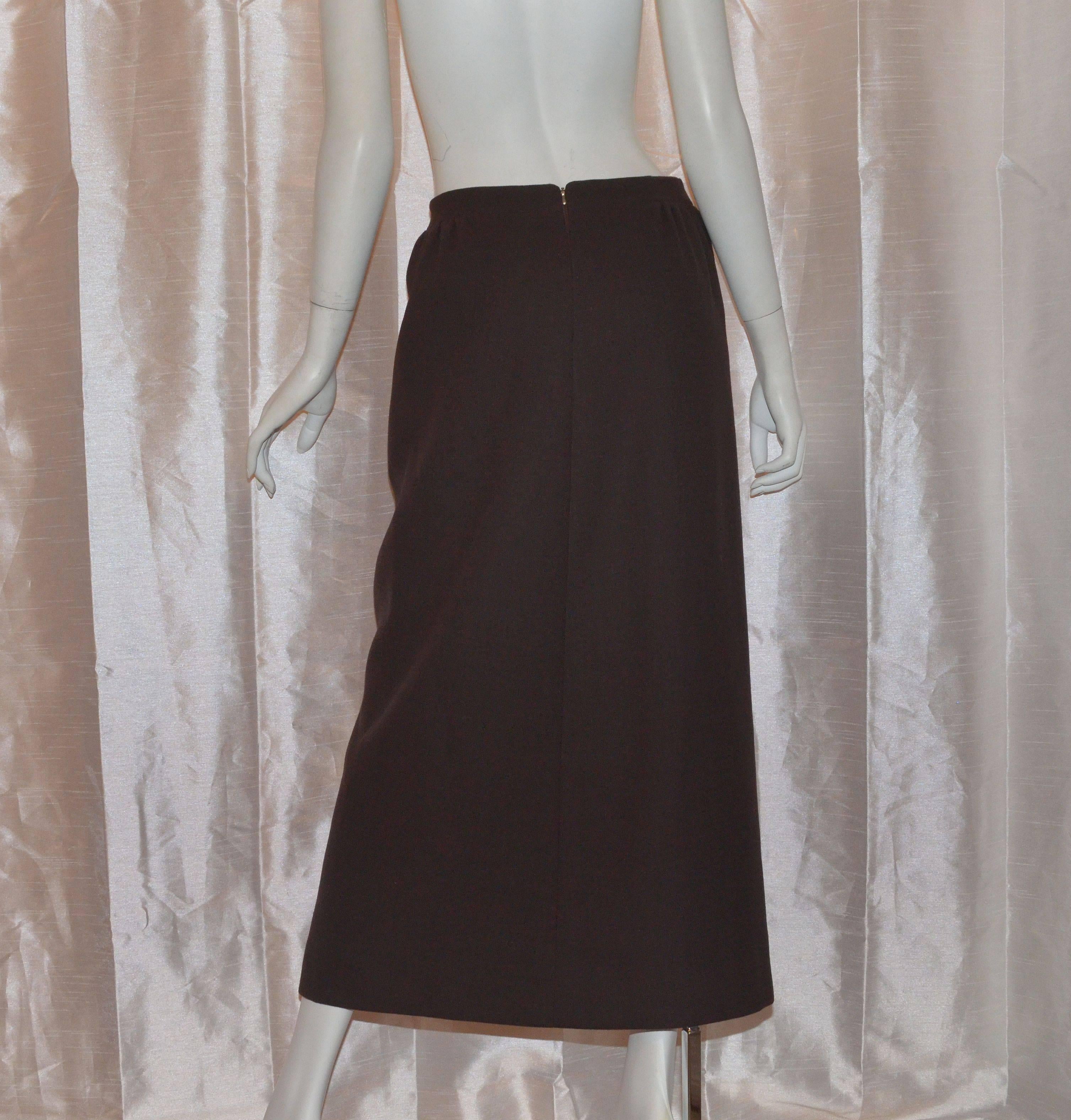 Pierre Cardin 1970's maxi skirt has color block mod pattern in neutrals and browns on the front and is made of structured wool. Closes with a back zipper and is fully lined.

Measurements:
Waist - 28''
Hips - 37.5''
Length - 36''
