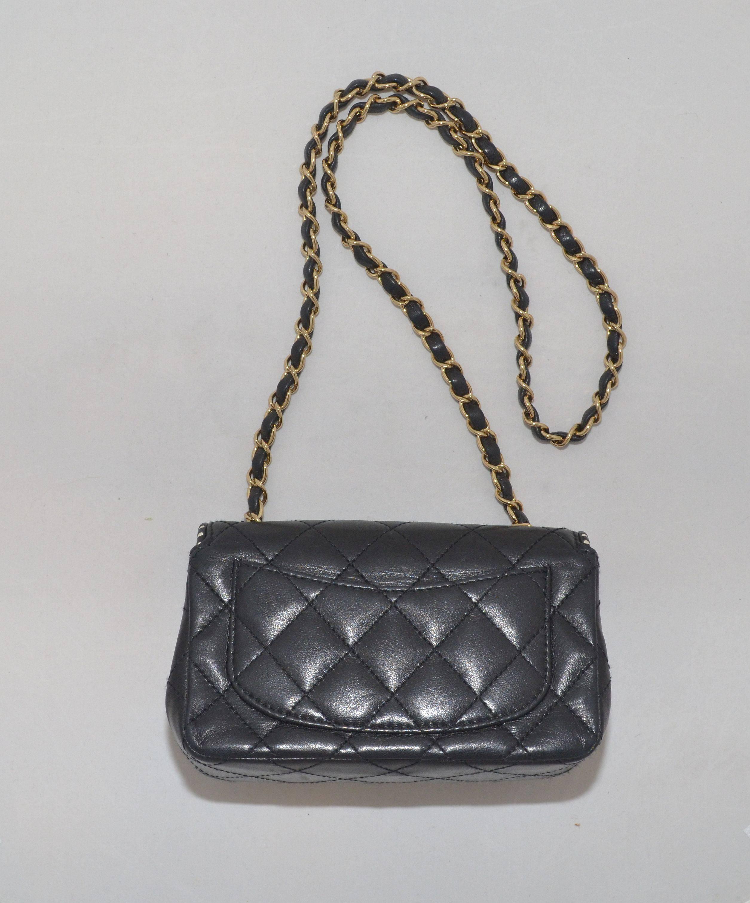 Chanel bag has gold-tone hardware, signature CC turn-lock closure, and a white and black striped trim along the flap opening. interior is lined in leather and has one slip pocket. Dust bag is included. Made in France.

Measurements:
7.25'' x