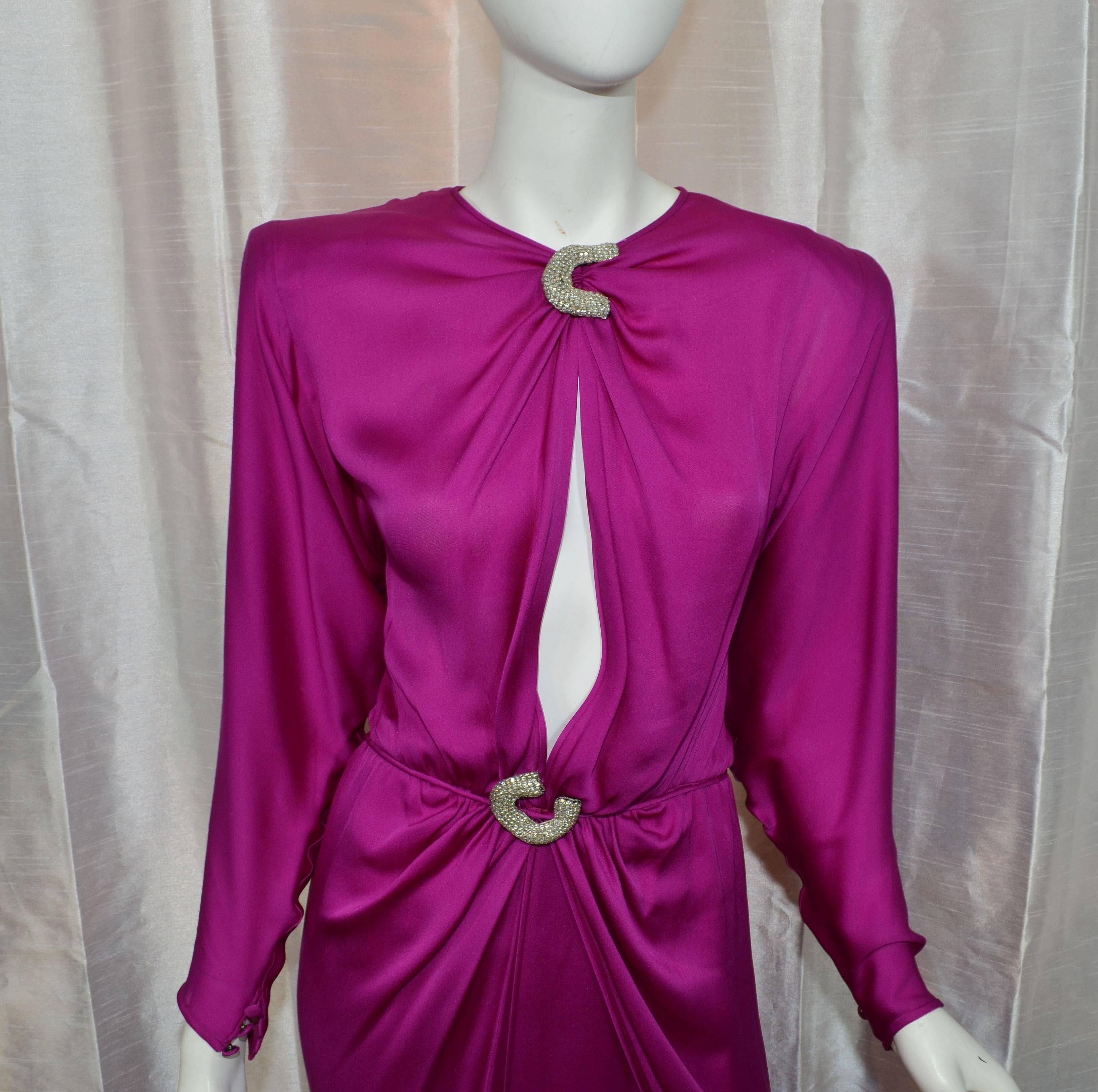 Valentino Satin Fuchsia Vintage 1980s Dress Embellished Keyhole Gown

Valentino gown featured in a fuchsia color on a satin fabric with a keyhole neckline, and a draped front. Dress has silver thread and mesh applique at the neck and waistline,