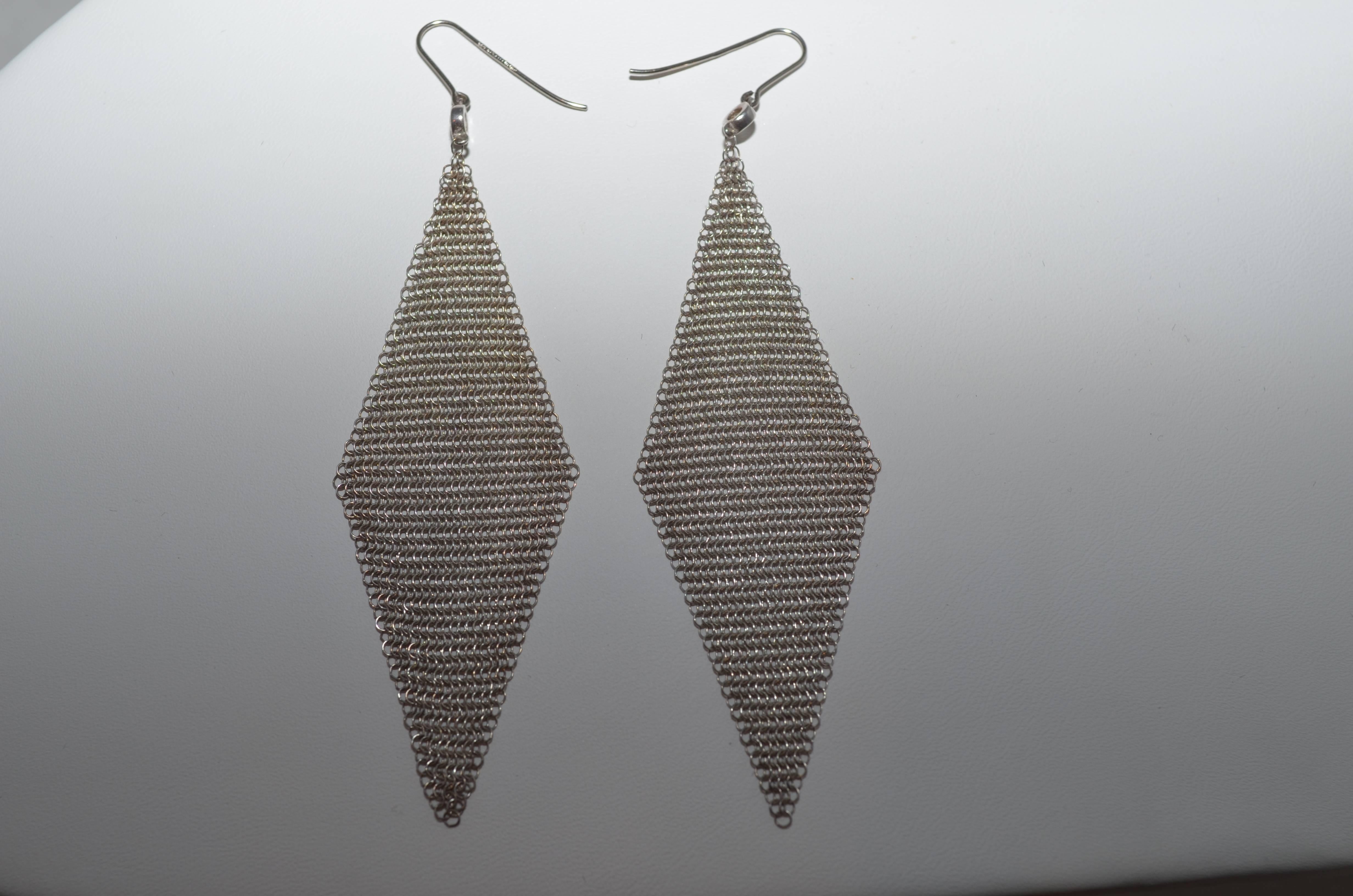 Tiffany & Co. Elsa Peretti Sterling Silver Mesh Scarf Earrings with Diamonds

One of Elsa Peretti's most popular designs for Tiffany & Co. Tiffany & Co. mesh scarf earrings in sterling silver with round  diamonds. Earrings are 3.25 inches long