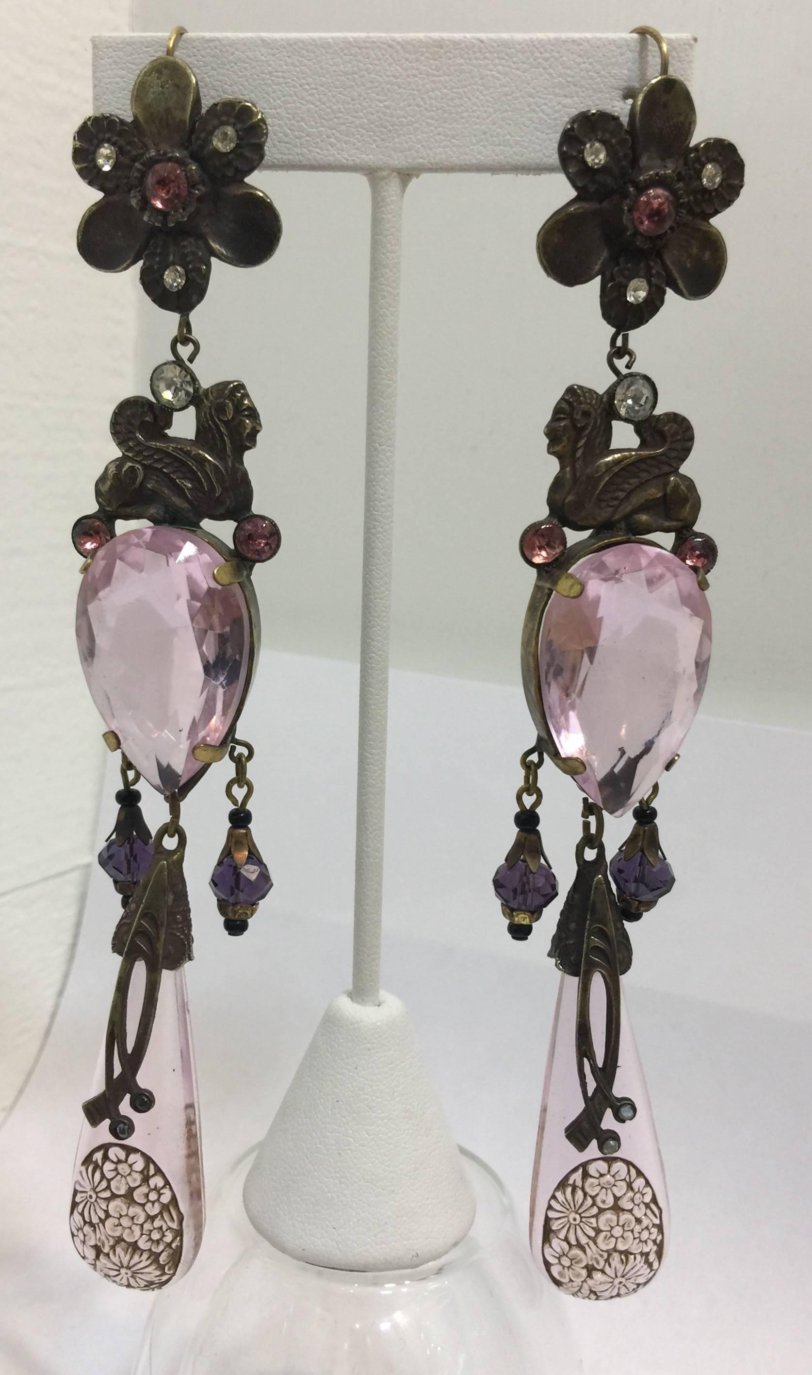 Shoulder duster 1920's Egyptian inspired Czech glass crystal drop chandelier earrings made from etched pink crystal drops and a large pink crystal stone. Metal appears to be antiqued brass. Pierced, French hooks. Design features flower tops, Sphinx