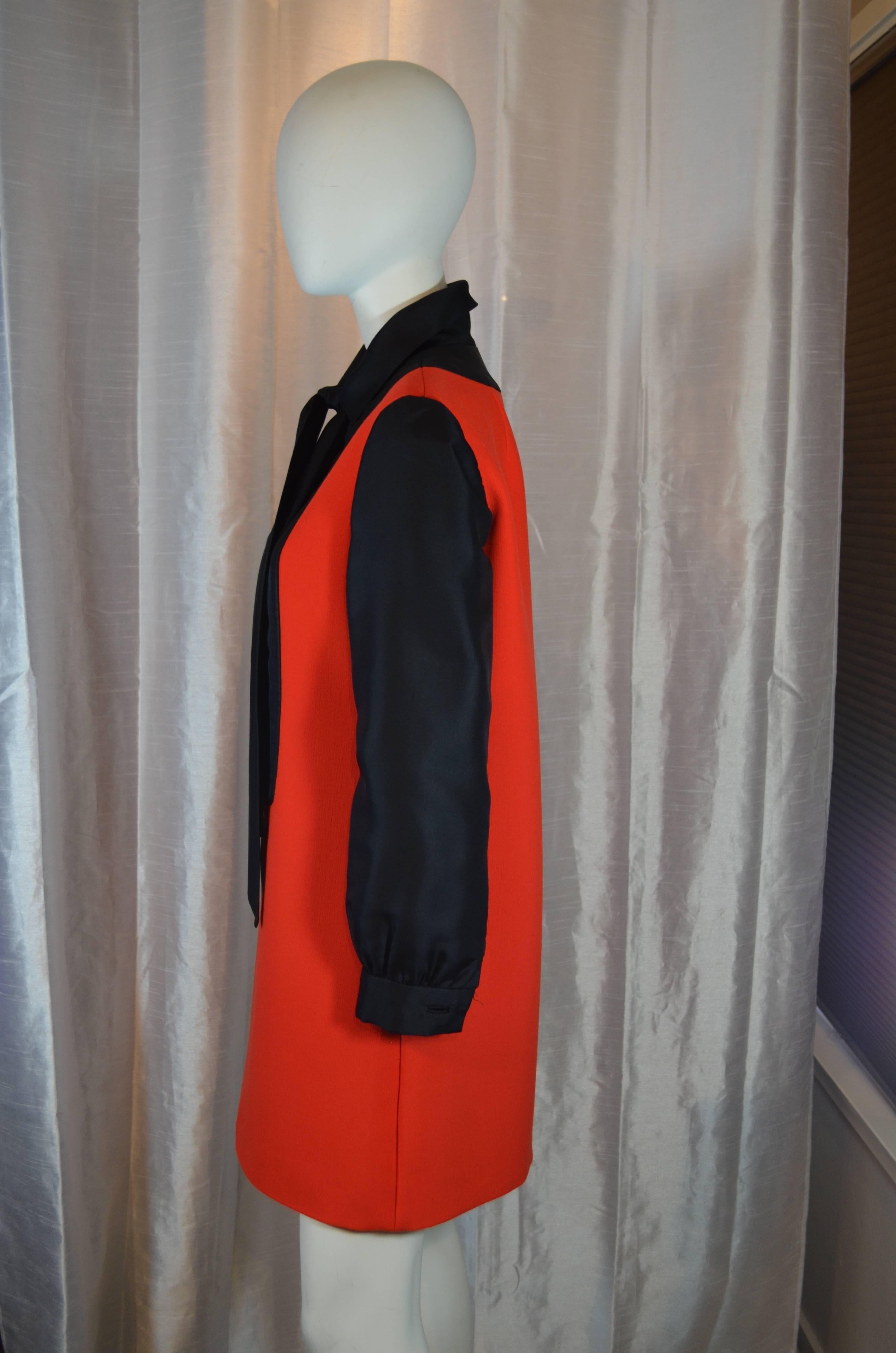 Vintage 1960's Geoffrey Beene black and red A-line tuxedo dress is in excellent condition.  The inside has red organza sheer lining and some minor rips and tears consistent with age.  The exterior of the dress is made from red wool crepe and black