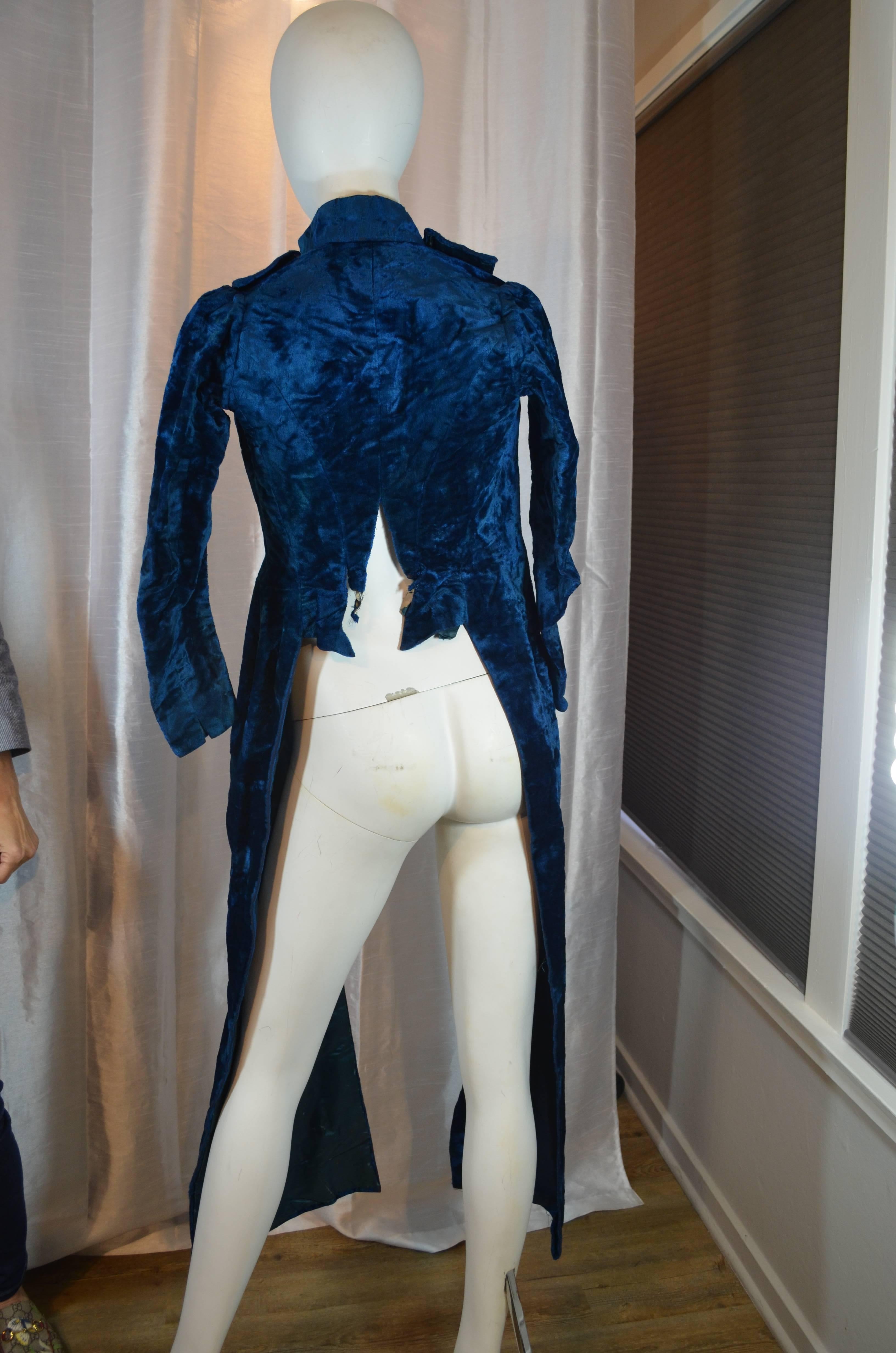 Victorian Blue Silk Velvet Jacket

Very nice non traditional design. Silk velvet outer with silk satin lining. Cut steel beadwork. Overall condition is poor, design is great, please see photos. 