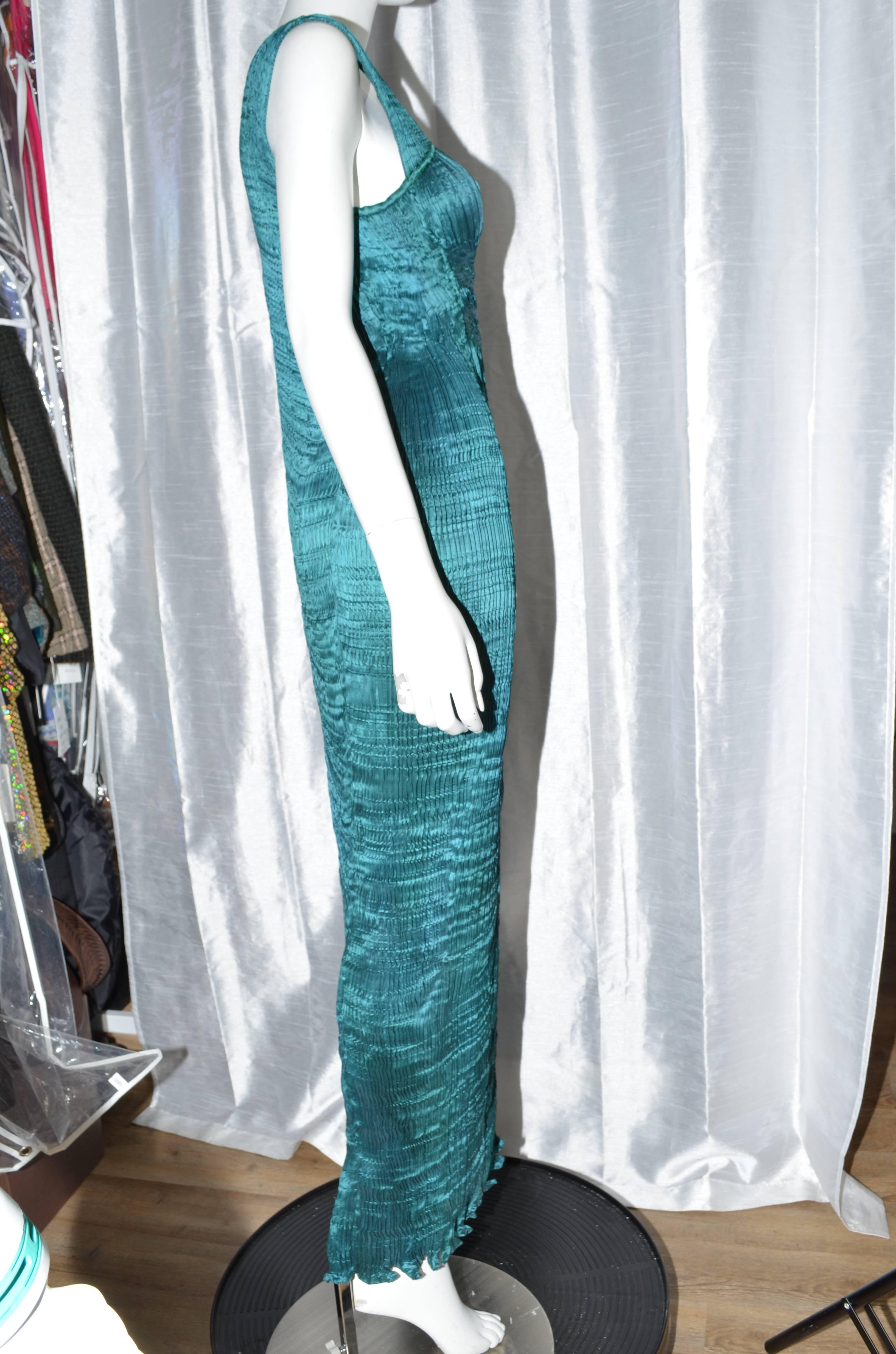 Beautiful Charles and Patricia Lester pleated silk gown in the style of Fortuny. Art to wear. This lovely emerald-blue gown is in excellent condition. Please see images for details. Best fits a medium or large, please see measurements. Estimated