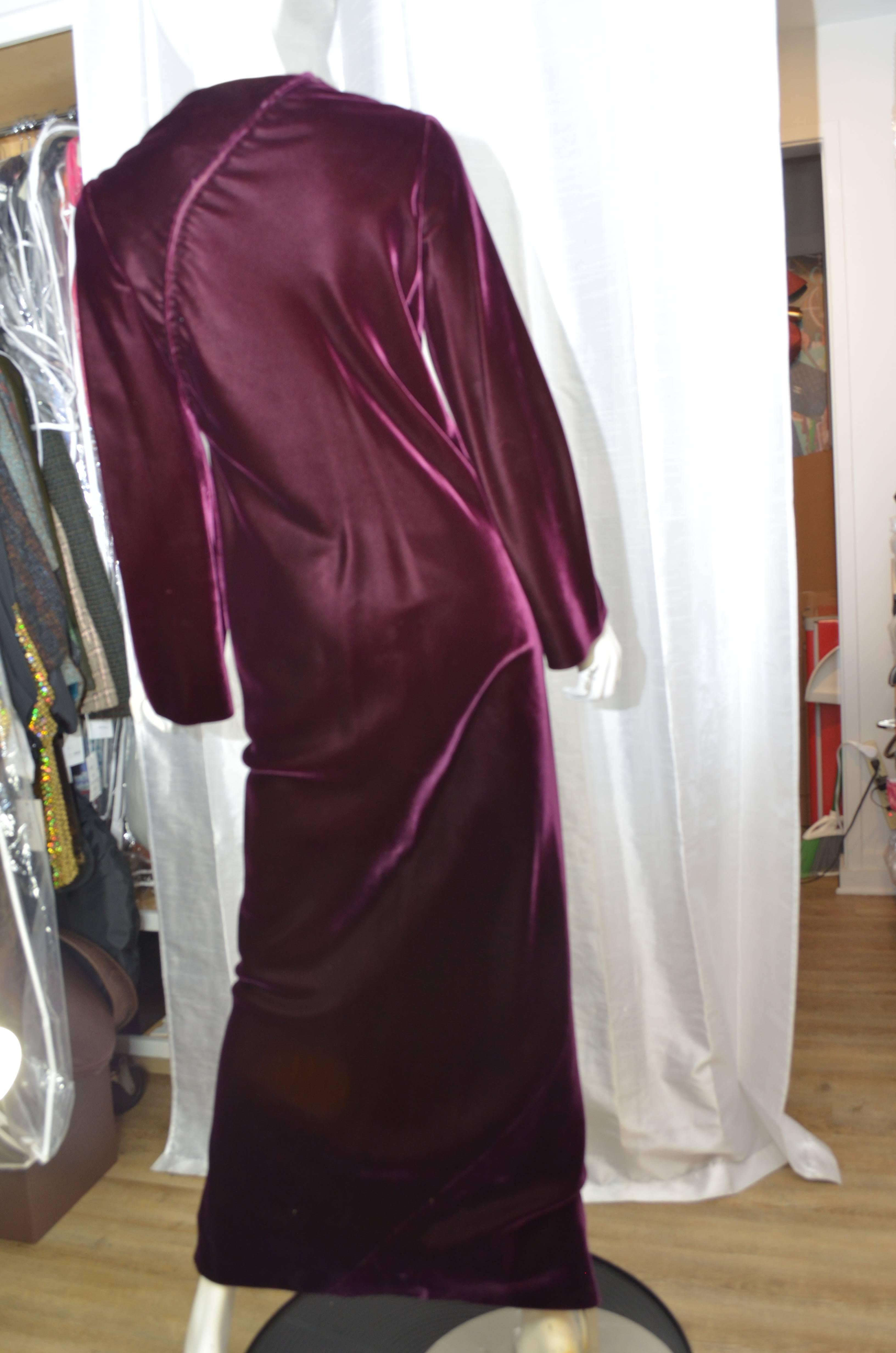 Fabulous vintage Halston gown in a beautiful burgundy silk velvet. This full-length, long flared sleeve dress features a gorgeous soft silk velvet cut on the bias, hand done diagonal zipper in the back. Fully lined. Please see images for