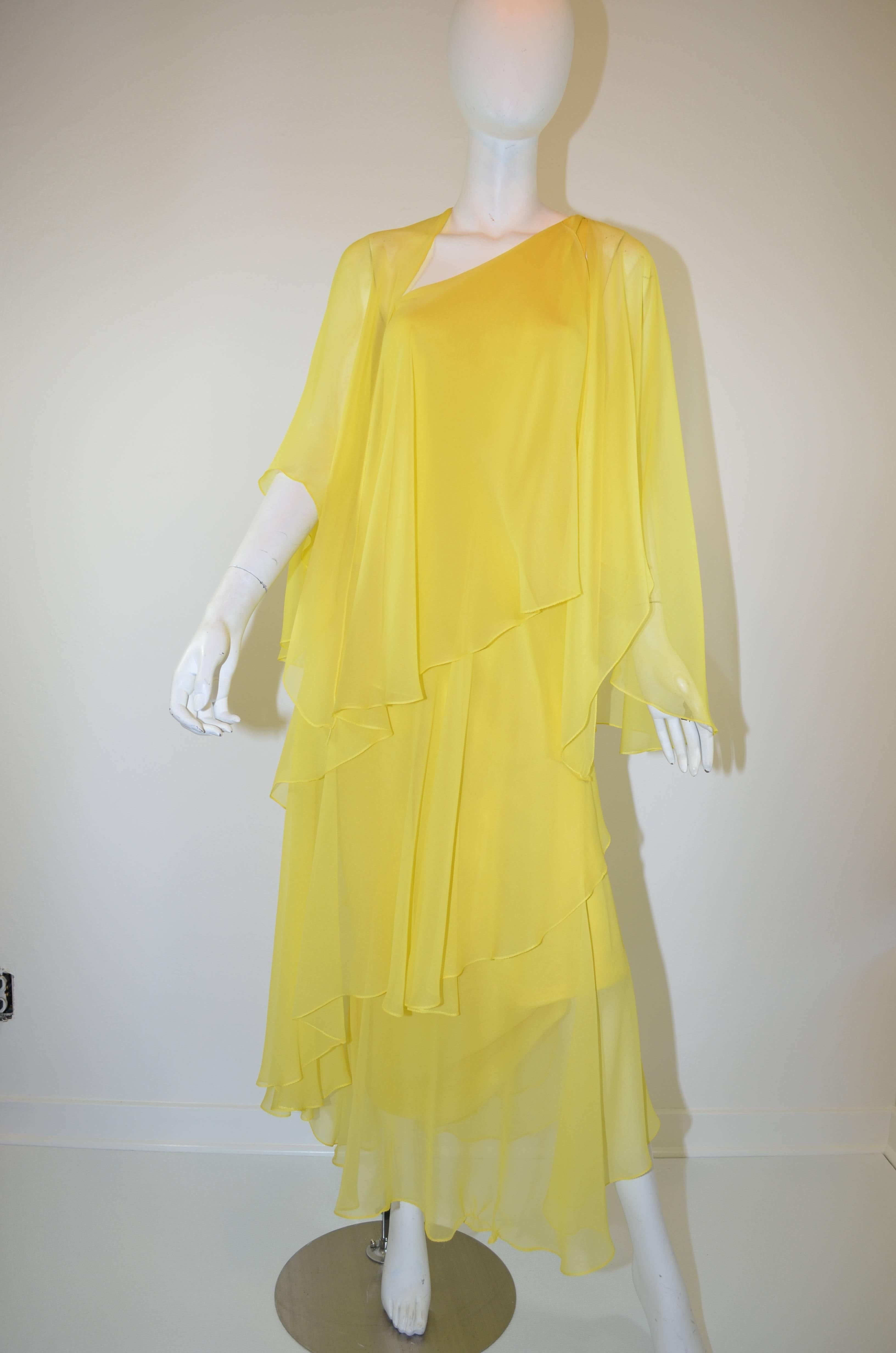 Beautiful Vintage Halston Yellow Silk Chiffon One-Shoulder Gown With Shawl

Vintage 1970's Halston yellow silk chiffon gown with optional shawl. This gorgeous one-shoulder gown features an adjustable tie closure. Lovely layered silk chiffon dress