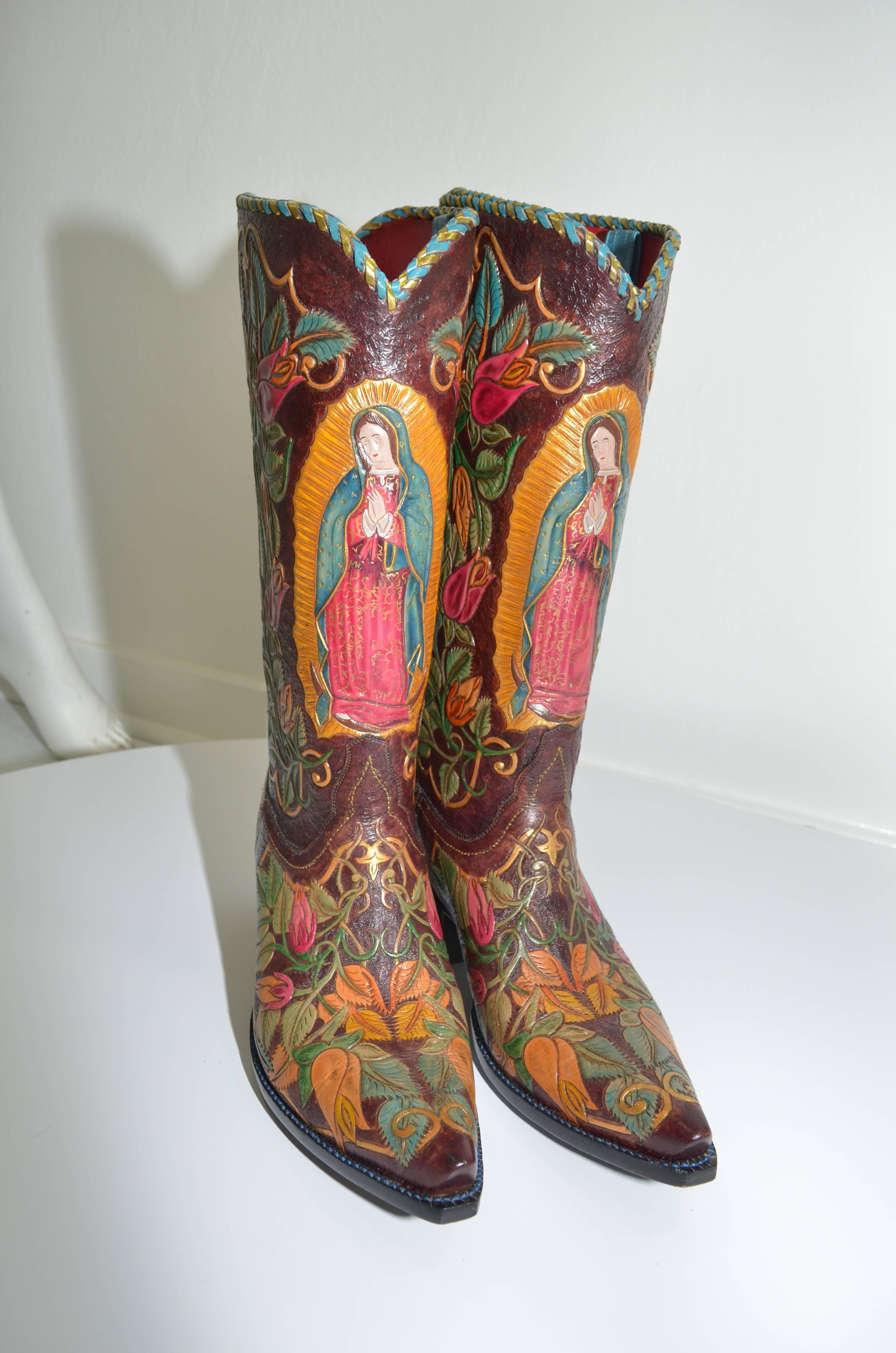 Very rare 40 Rosas Nuestra Señora de Guadalupe couture custom cowboy boots from bespoke custom bookmakers Tres Outlaws. Boots are hand braided, hand tooled, hand painted and take over 400 hours for a craftsman to make. Boots are signed by the maker