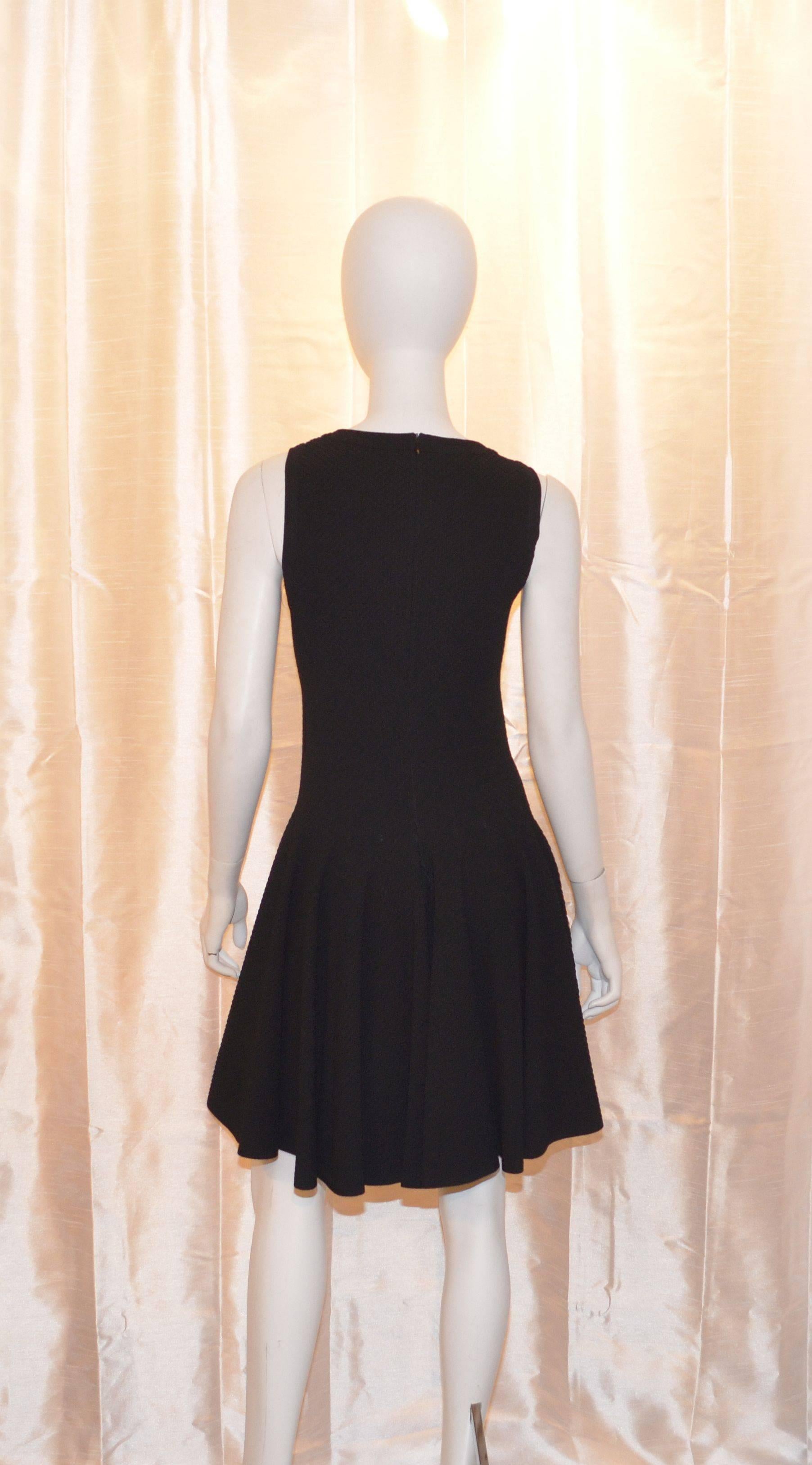 Alaia dress is made with 75% viscose, 15% polyester, and 10% nylon. Dress has a back zipper closure. Fits a size medium. Newer dress still has the tags attached and is in unworn condition. Labeled a size 44, made in Italy.

Measurements: