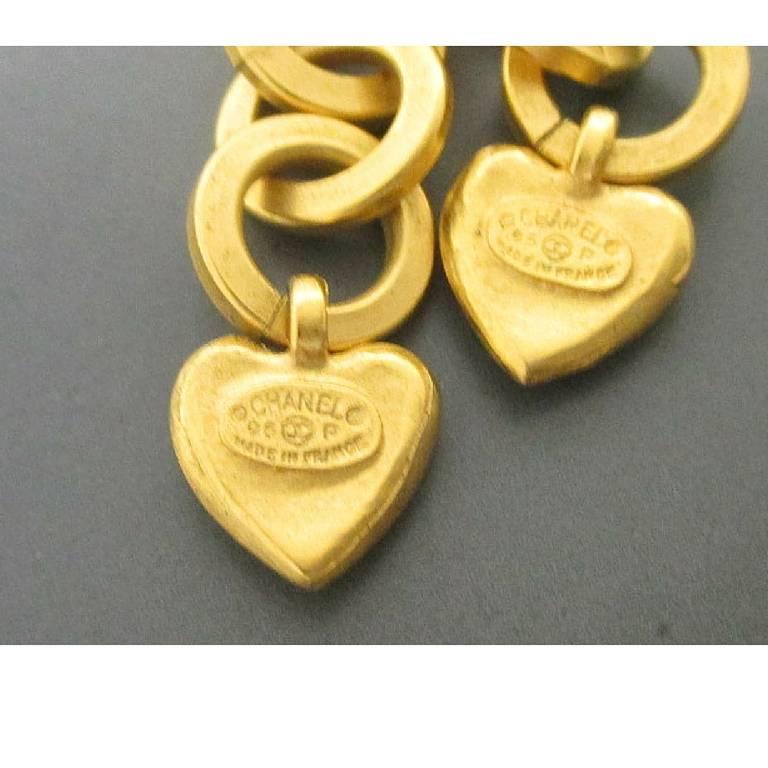 Vintage CHANEL rare golden dangling earrings with hoop chain, heart, arabesque motif, and CC mark. One-of-a-kind jewelry.

Introducing one-of-a-kind, hard-to-find vintage CHANEL jewelry, golden dangling earrings from the 90's.
If you are a