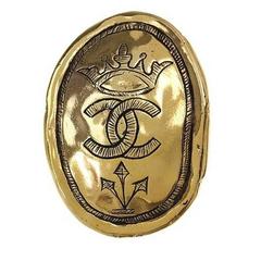 Vintage CHANEL gold tone large brooch in oval coin shape with CC logo and crown 