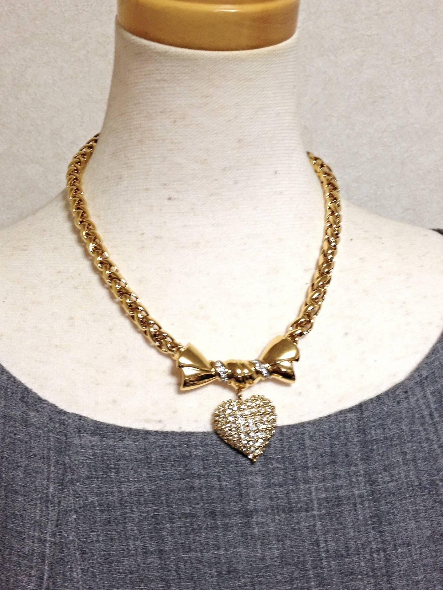 Women's MINT. Vintage Nina RIcci golden chain statement necklace with bow and heart top For Sale