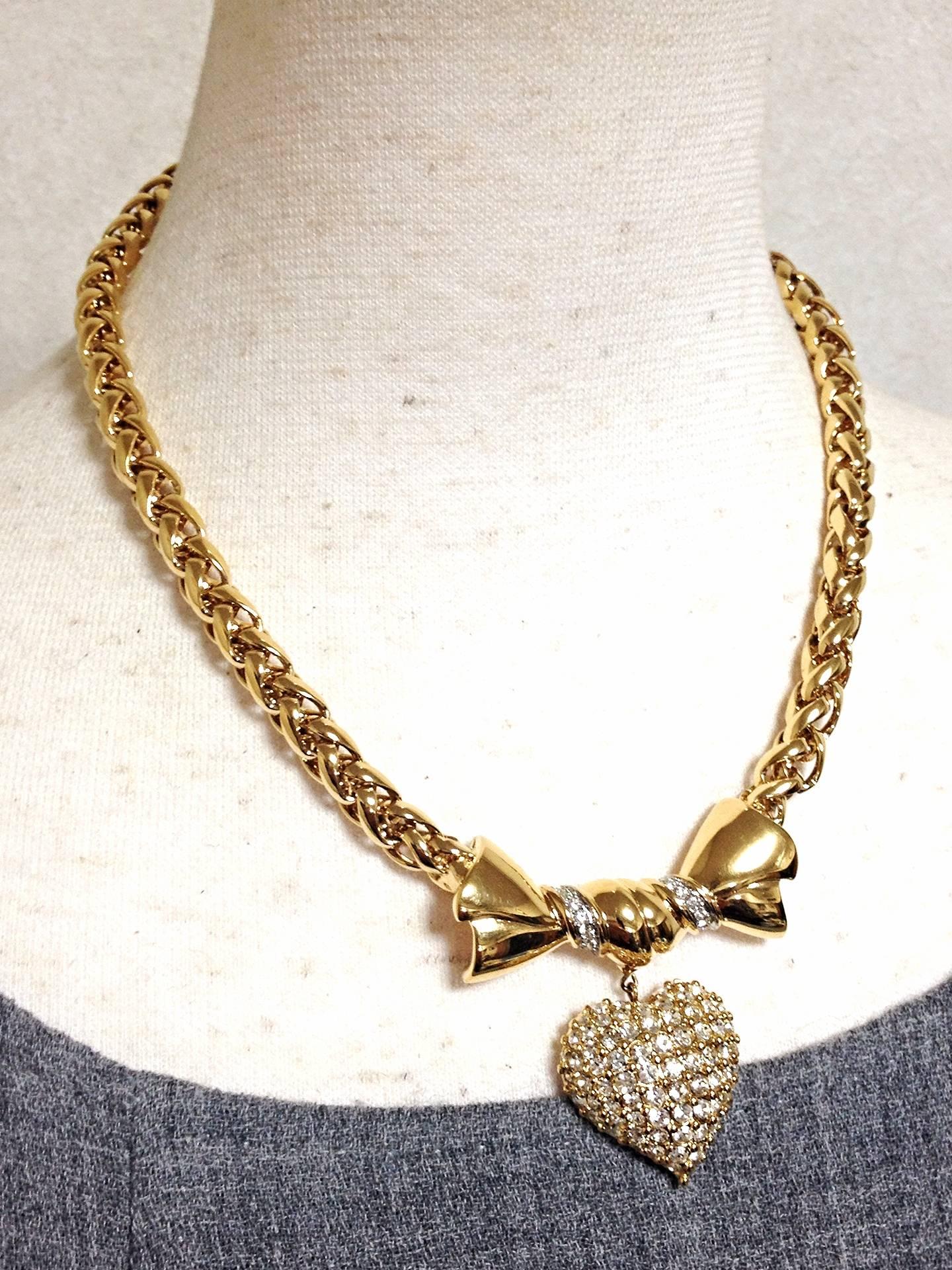 MINT. Vintage Nina RIcci golden chain statement necklace with ribbon bow and crystal stone heart pendant top. Perfect vintage jewelry.

Fun and Chic and Gorgeous piece from Nina Ricci! Great gift idea. Free gift wrapping. 
MINT/NEW