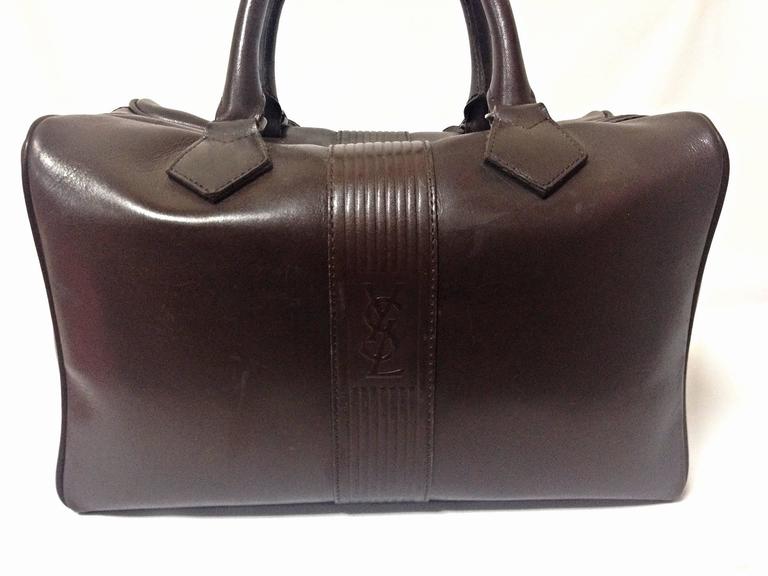 Vintage Yves Saint Laurent genuine dark brown leather daily use duffle bag. Clas For Sale at