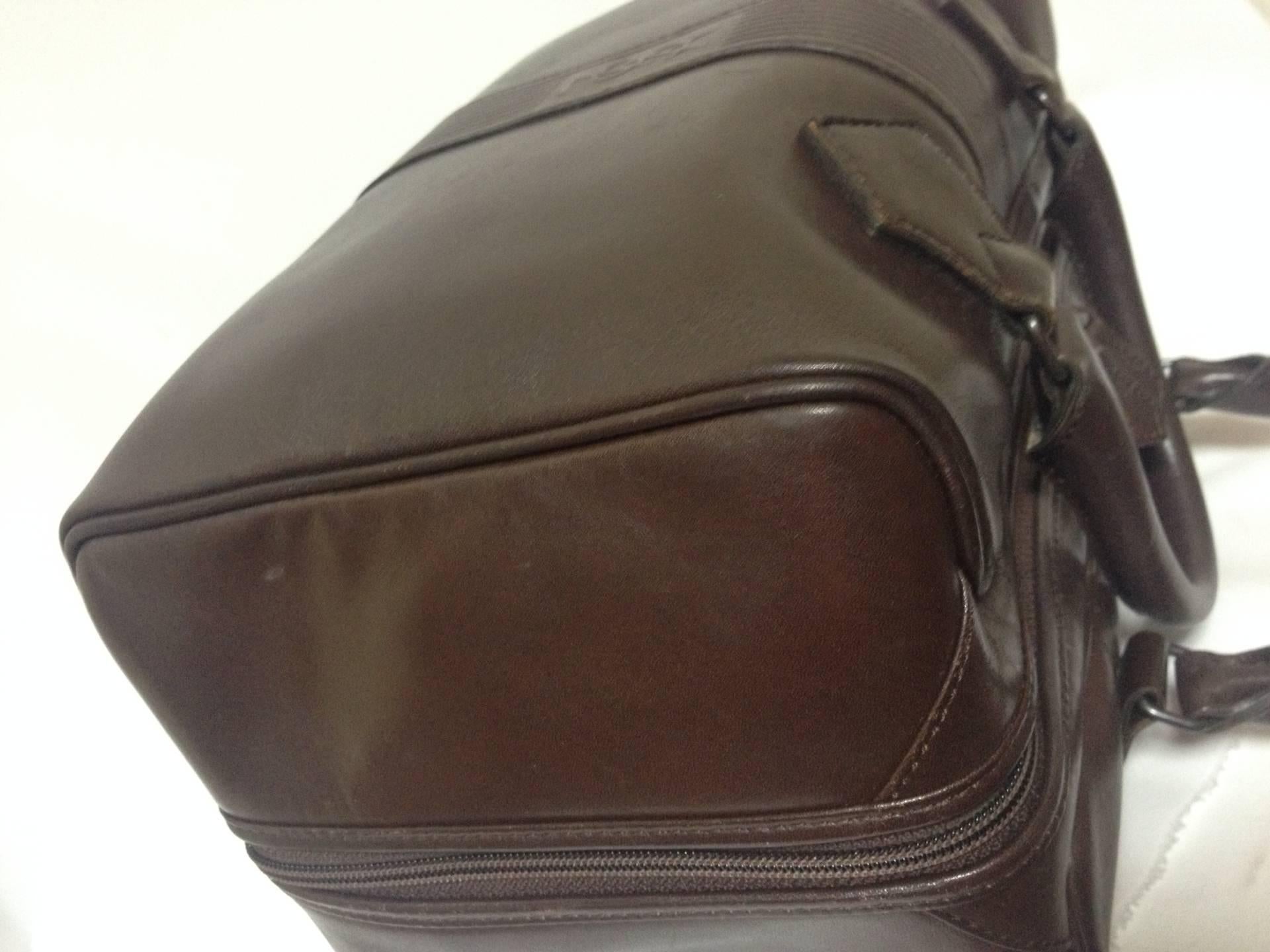 Gray Vintage Yves Saint Laurent genuine dark brown leather daily use duffle bag. Clas For Sale