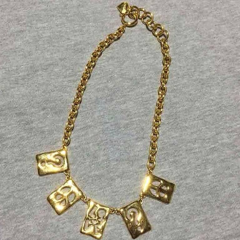 MINT. Vintage Moschino chain statement necklace with square plate with cut out question mark, love and peace mark charms. Moschino BIJOUX
Introducing another rare and fabulous jewelry necklace from MOSCHINO collection back in the 90's.
It is a