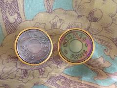 MINT. Vintage HERMES golden logo embossed genuine shell earrings.