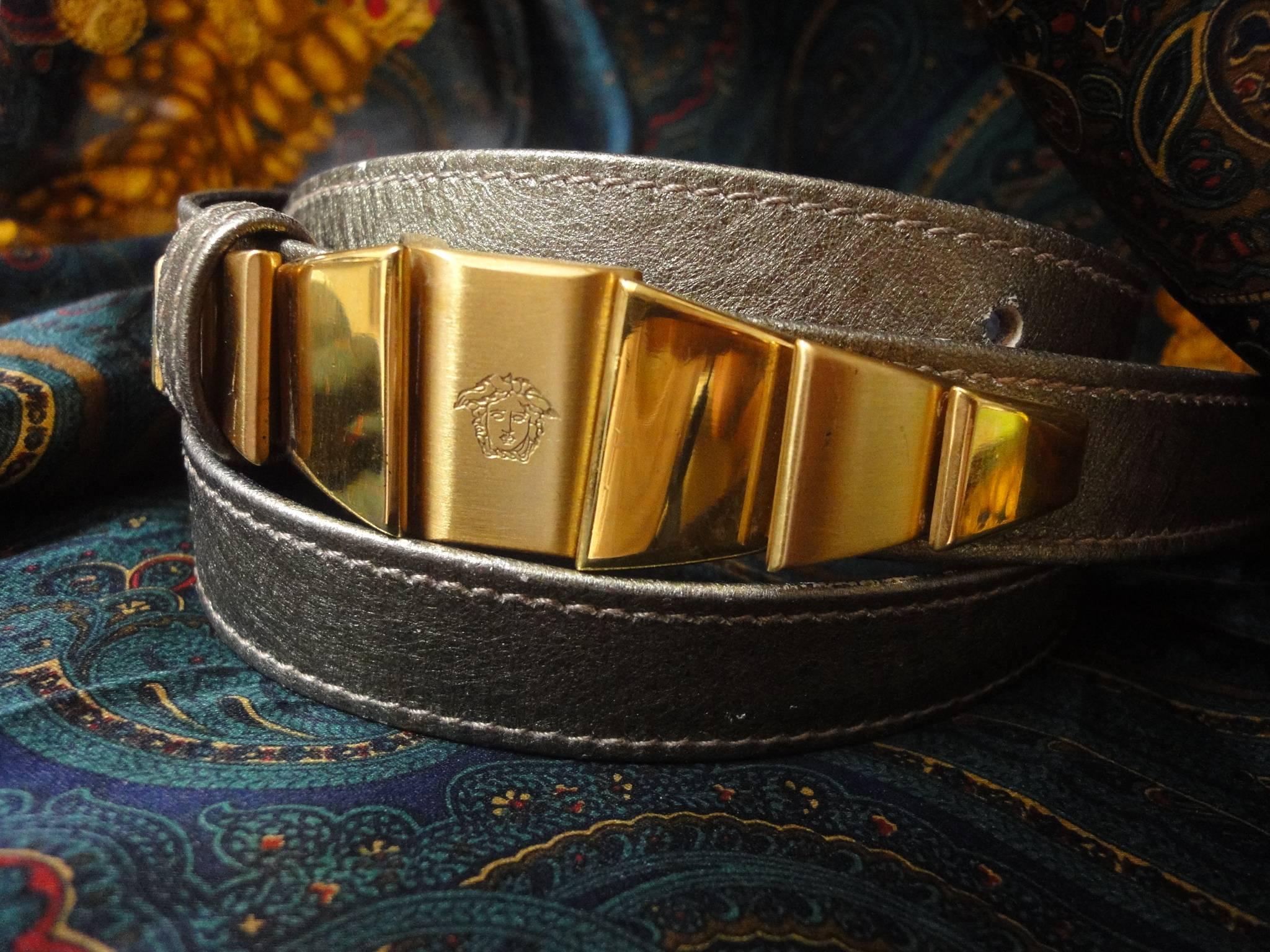 Vintage Gianni Versace skinny gold bronze leather belt with golden hardware and medusa.  Size from 25, 26, 27 inch. Lady Gaga look.

Introducing a rare and fab vintage belt in golden and bronze tone leather from Gianni Versace.
Featuring a gold