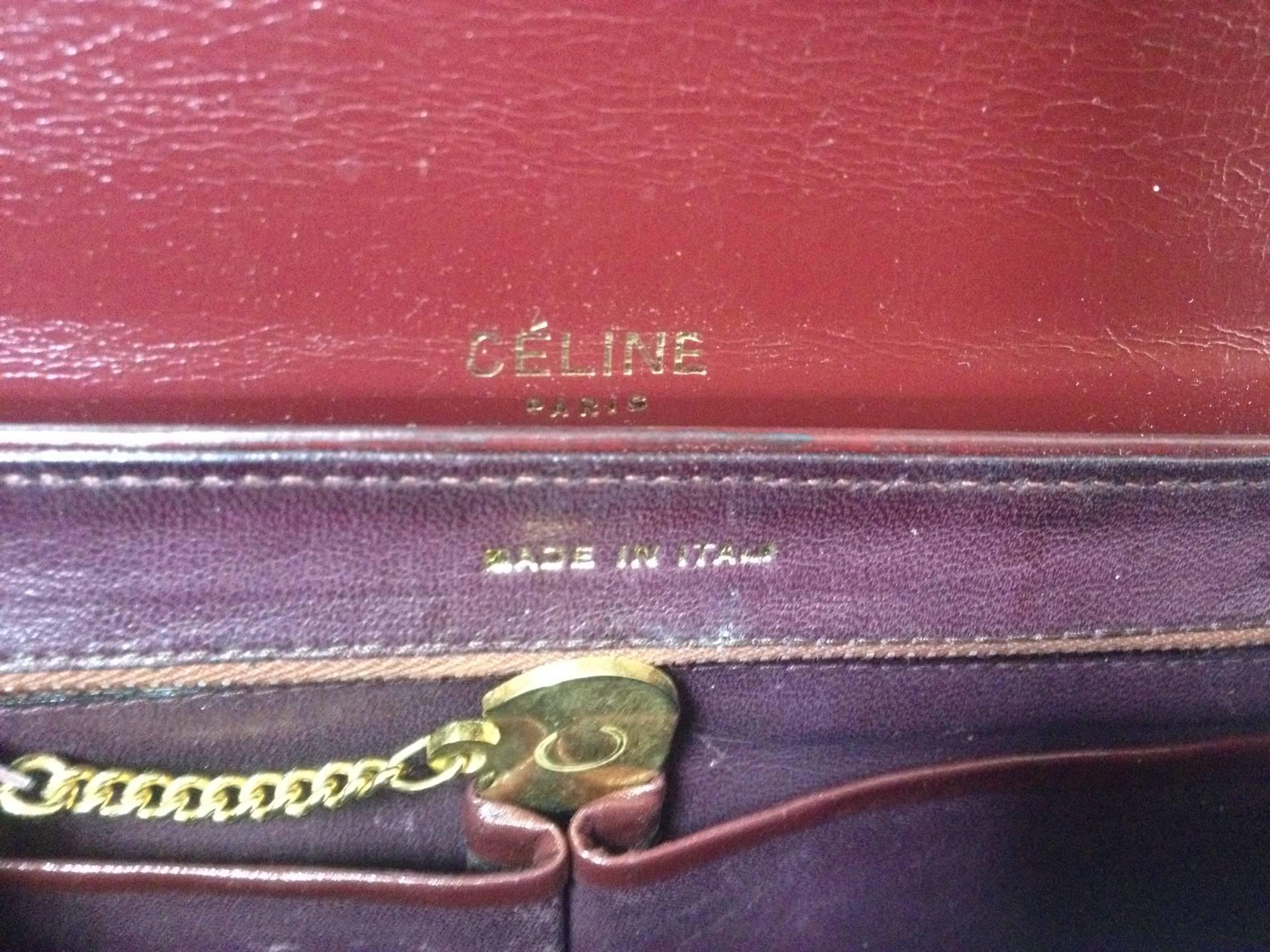 intage CELINE genuine wine brown leather clutch bag with golden carriage logo. 1