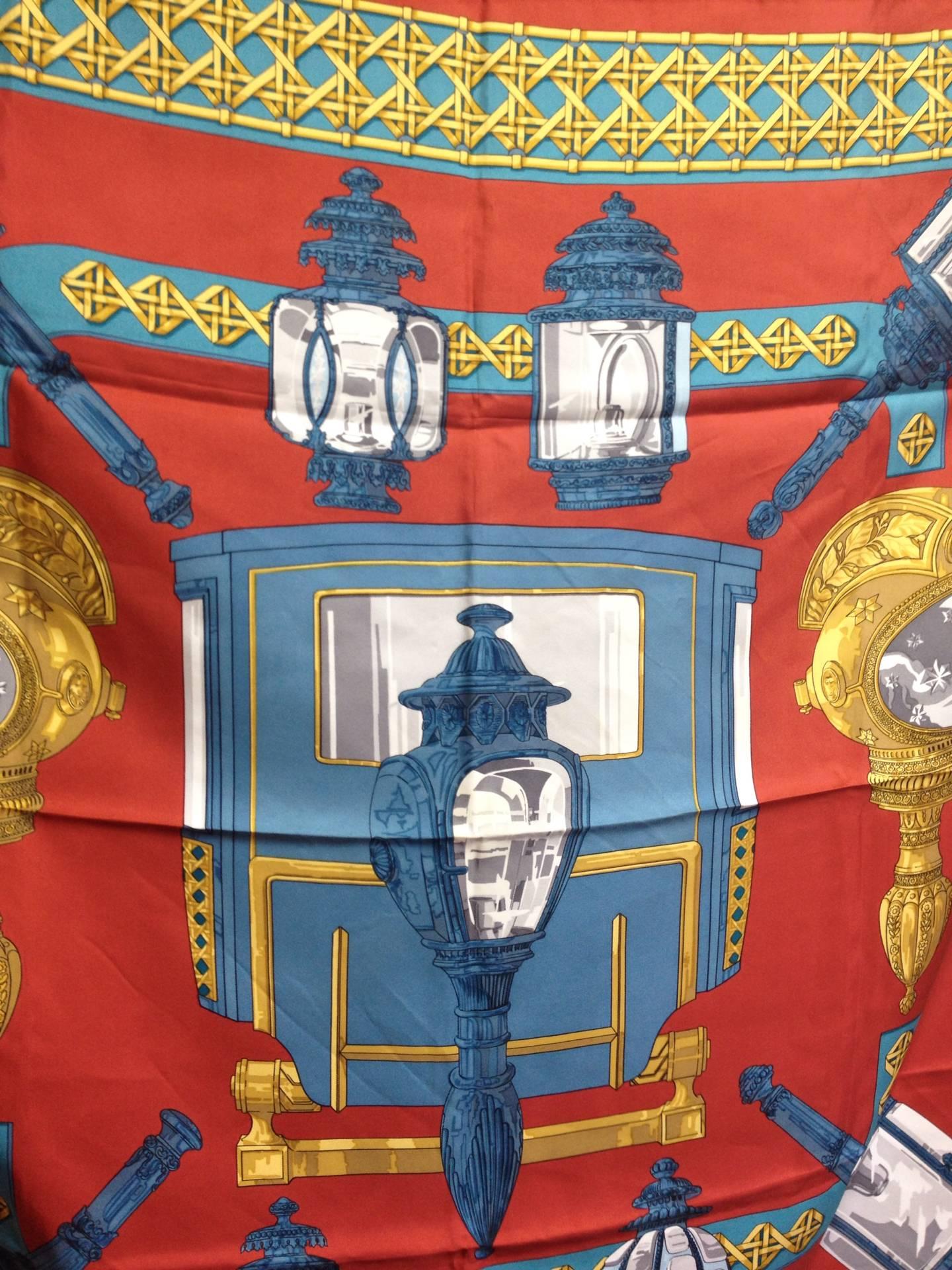 This is a 100% twill silk scarf from HERMES in the 90s. 

Gorgeous multicolor in light brick red, blue, light blue, and gold with motifs such as armor, knight shape lamp design. 

Perfect piece for your daily and special occasion use on any