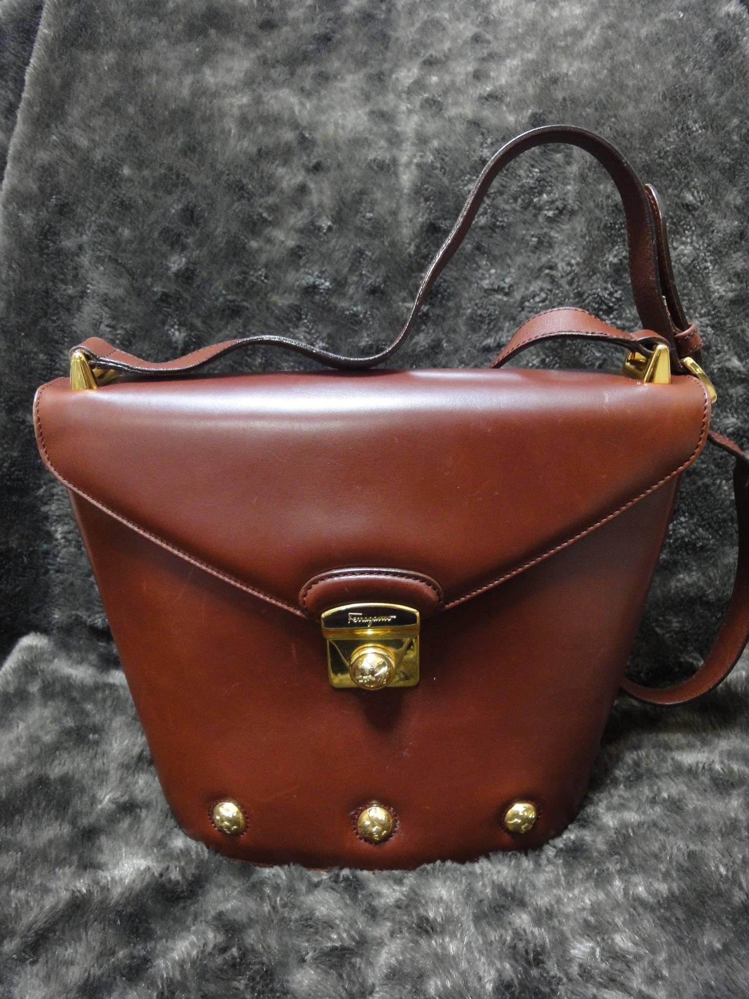Vintage Salvatore Ferragamo brown leather trapezoidal shape purse with motifs. 3