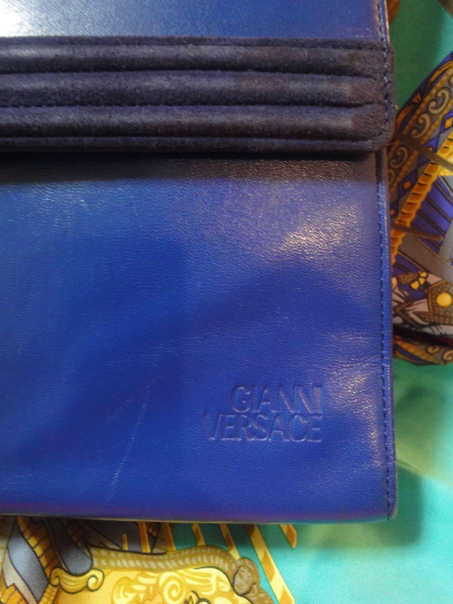 Women's Vintage Gianni Versace blue smooth and suede leather handbag purse with a bow. 