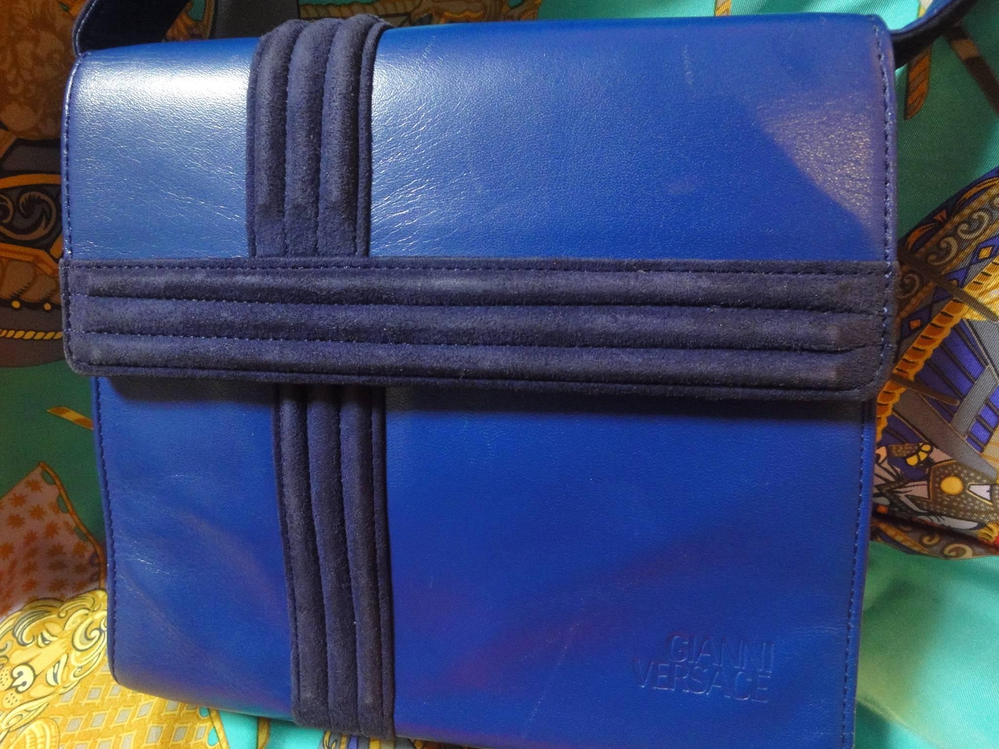 Blue Vintage Gianni Versace blue smooth and suede leather handbag purse with a bow. 