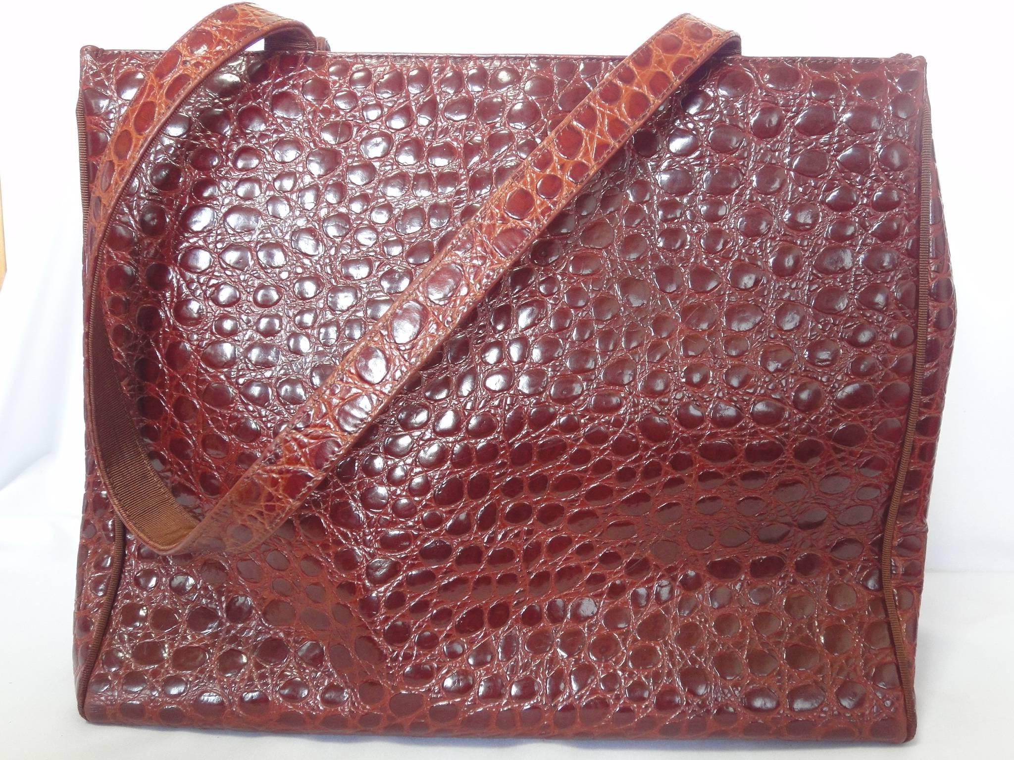 Vintage Salvatore Ferragamo brown croc embossed genuine leather tote from vara collection.

Vintage Salvatore Ferragamo brown croc embossed leather tote in genuine leather from Vara collection.
The logo is embossed on the golden hardware at