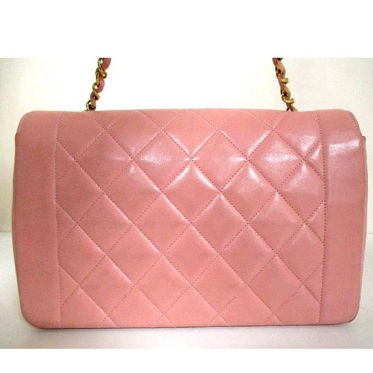 Vintage CHANEL pink color lambskin classic 2.55 shoulder purse with gold tone chain strap. Make you even more chic. Think spring

This is a vintage classic 2.55 purse with gold chain strap from Chanel from the 90's.
Rare pink color lambskin bag