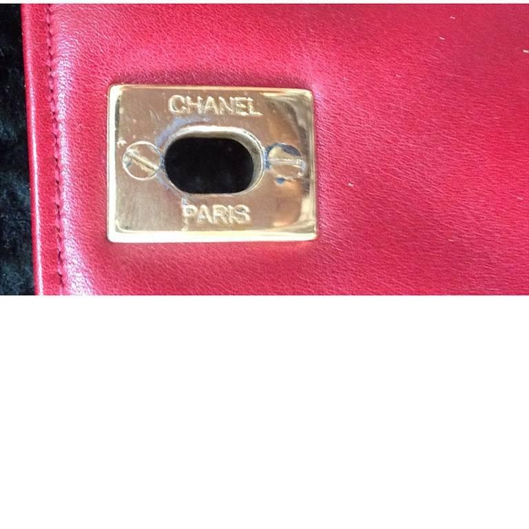Women's Vintage CHANEL lipstick red lambskin pouch with golden CC closure in chevron V.