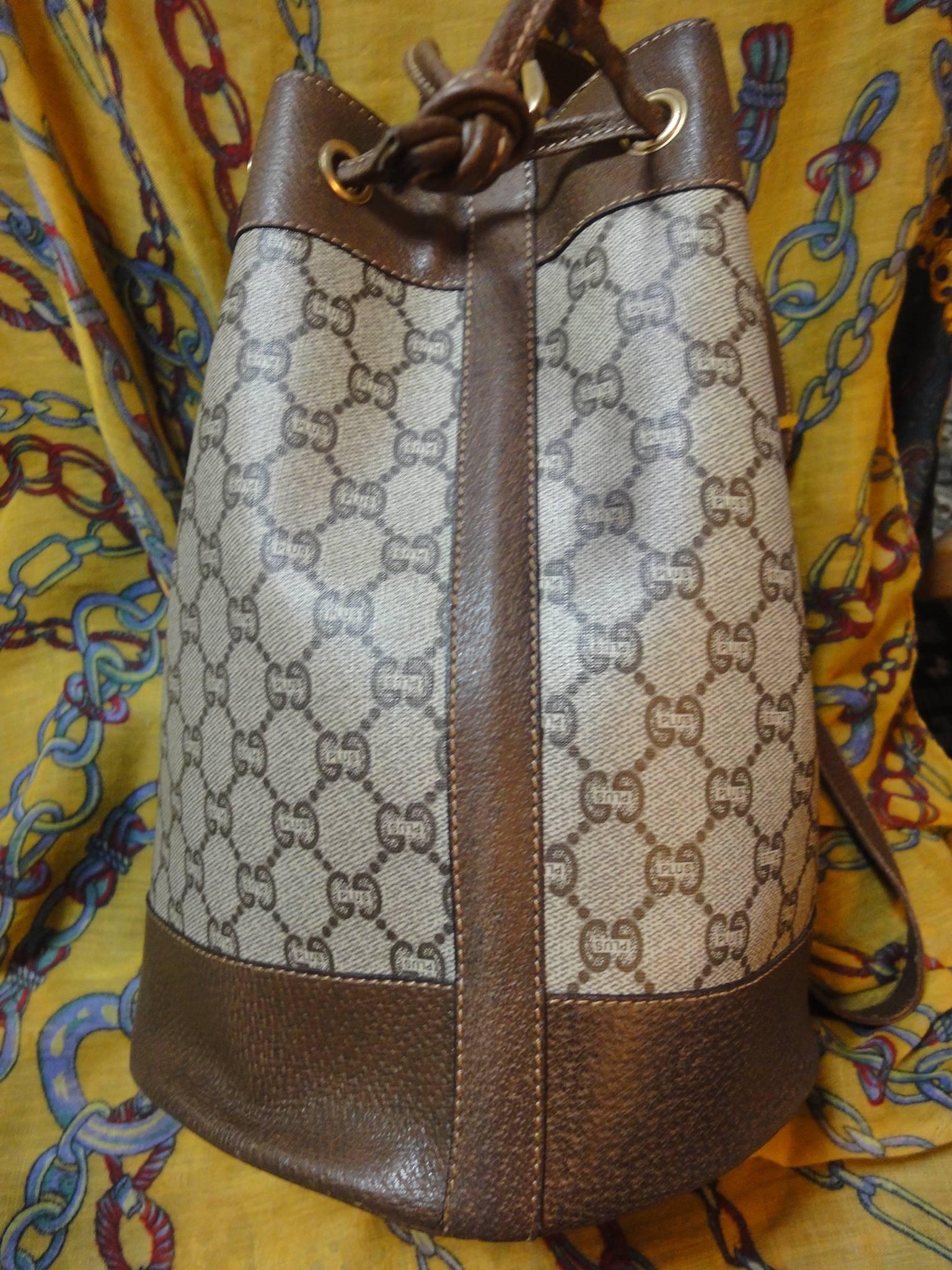 Vintage Gucci Plus monogram and leather hobo bucket purse with drawstrings. Great masterpiece for your another Gucci collection. riri zipper.

This is a unique Gucci Plus vintage monogram hobo bucket bag with leather trimmings and strap. hobo bag