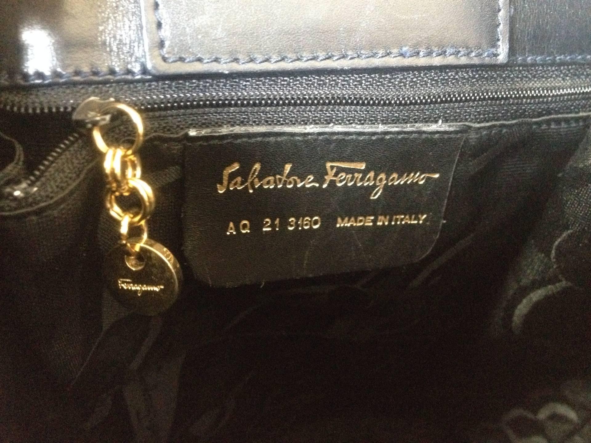 Black Vintage Salvatore Ferragamo dark navy leather shoulder bag with gancini closure.