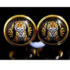 MINT. Vintage Hermes cloisonne golden round earrings with tiger design in black.
