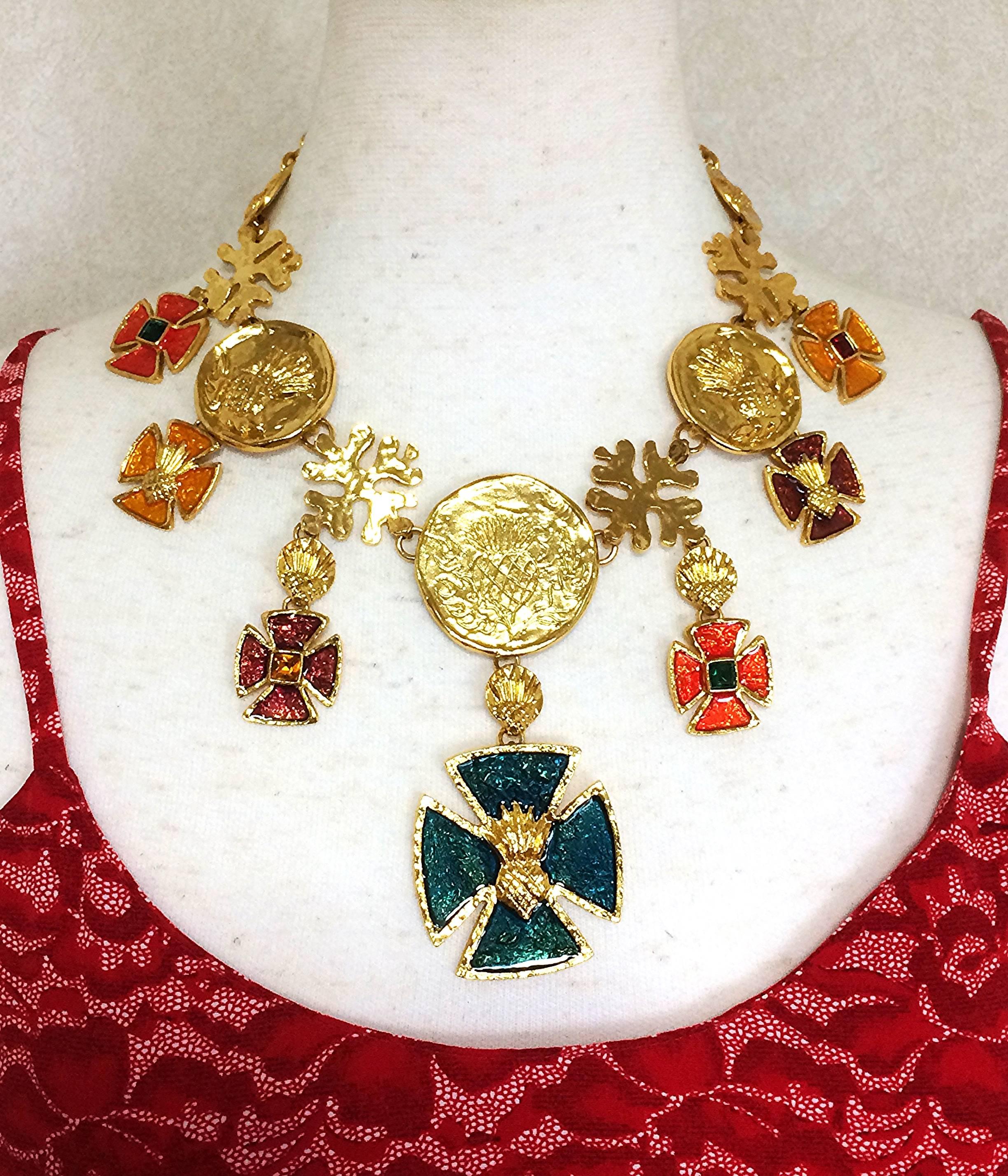 MINT. Vintage Yves Saint Laurent statement necklace with blue, wine, orange, yellow, and green colorful enamel cross and coin motif charms. 

Introducing a one-of-a-kind, Yves Saint Laurent Haute Couture collection statement necklace from the