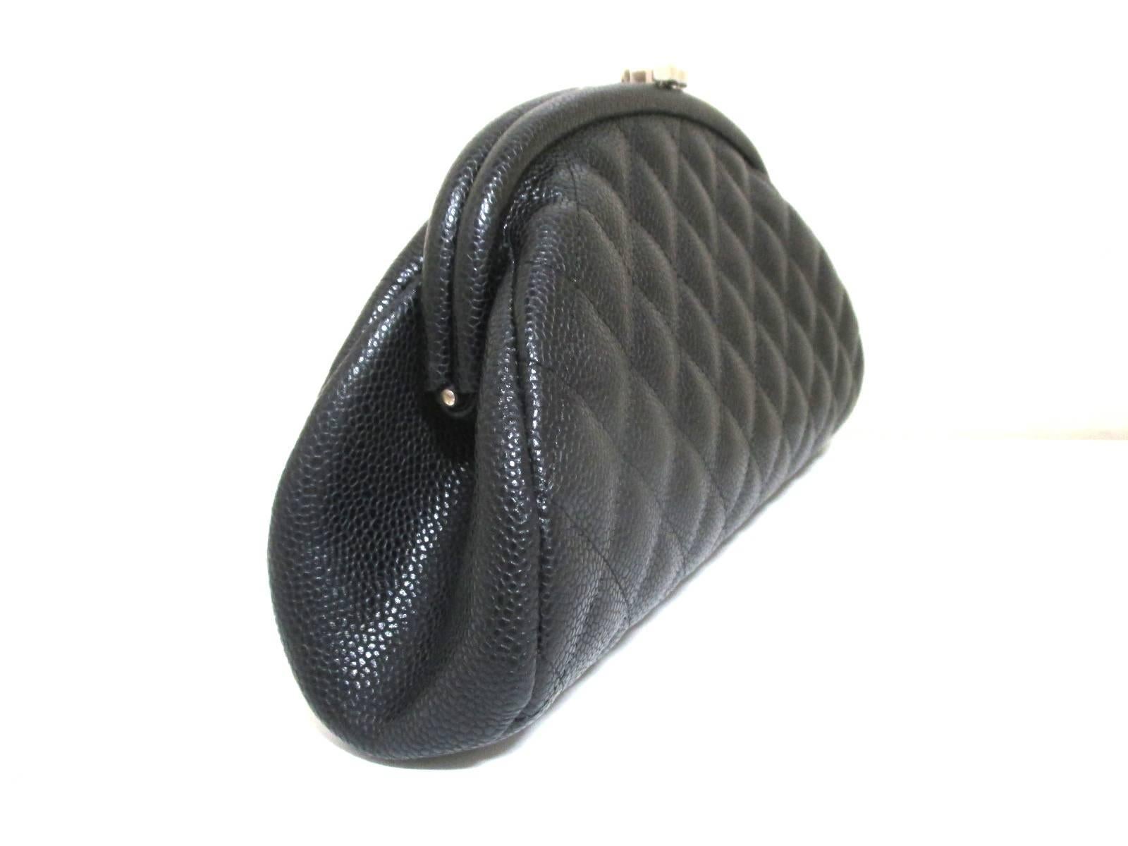 MINT. Vintage CHANEL kiss-lock closure large black caviar leather pouch purse with silver tone CC motif. Rare chic and mod bag for party, cosmetics, toiletries use.

MINT. Vintage CHANEL black lamb leather quilted large clutch purse with kiss lock