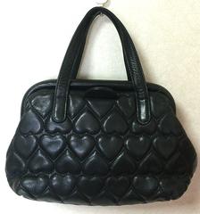 Vintage MOSCHINO black heart shape quilted lambskin mini handbag, tote purse.