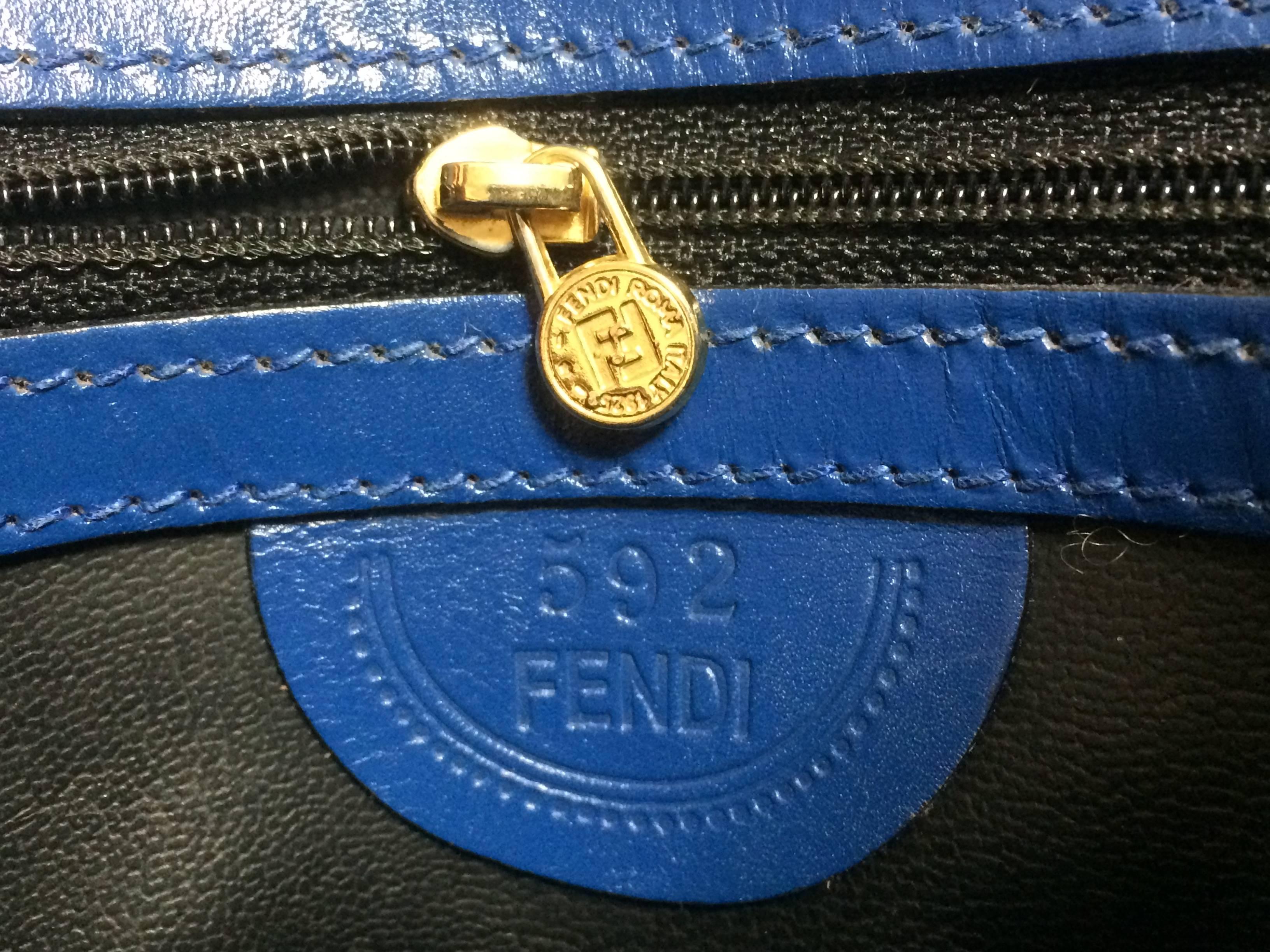 Blue Vintage FENDI blue leather classic kelly style handbag with iconic Janus motif. For Sale
