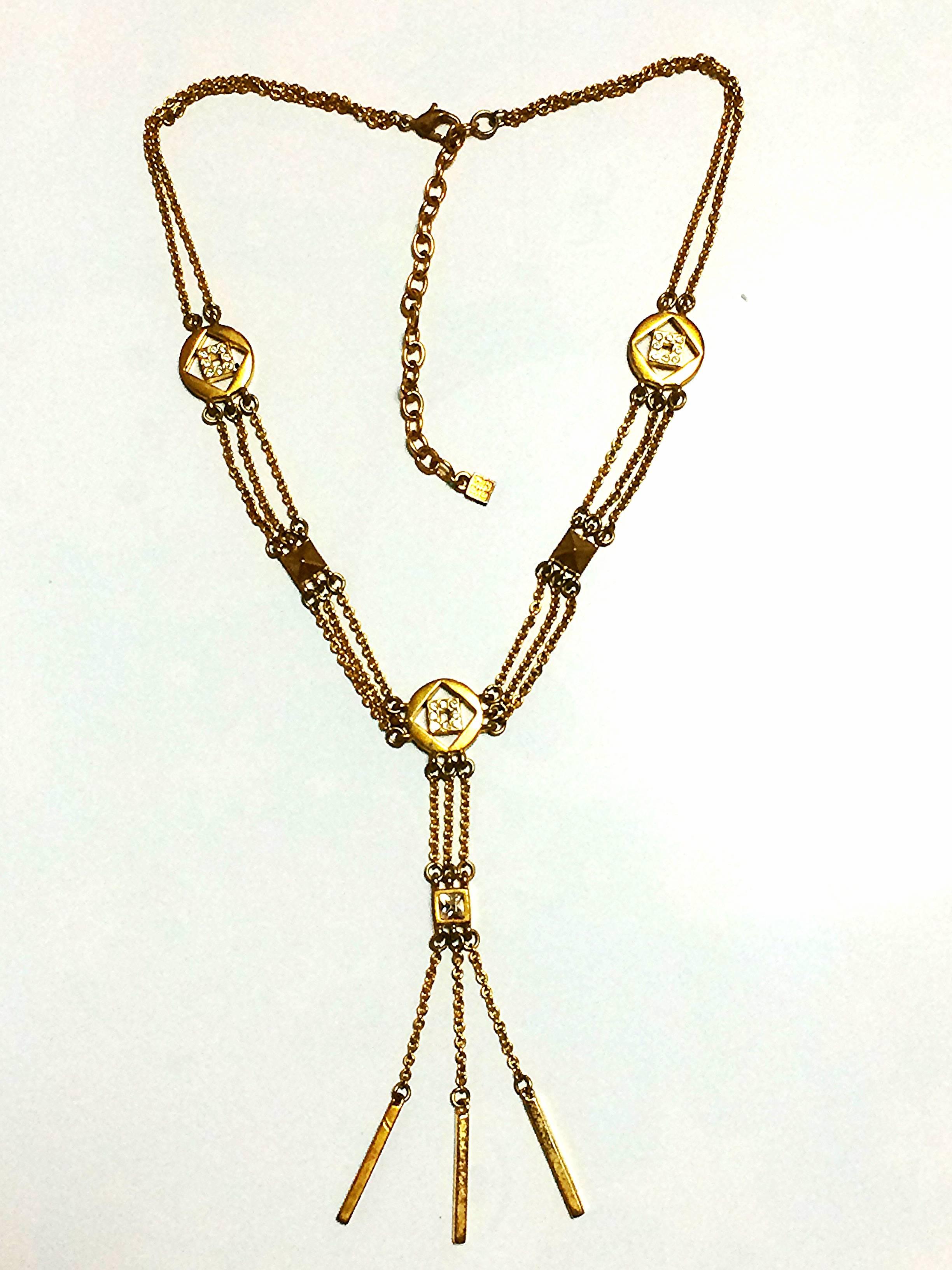 1990s. Vintage Givenchy three layer gold chain long necklace with rhinestone crystal logo charms. Statement necklace back in the era. Audrey Hepburn.

Another FAB and stunning jewelry necklace from GIVENCHY back in 90's.
Consisting of rhinestone
