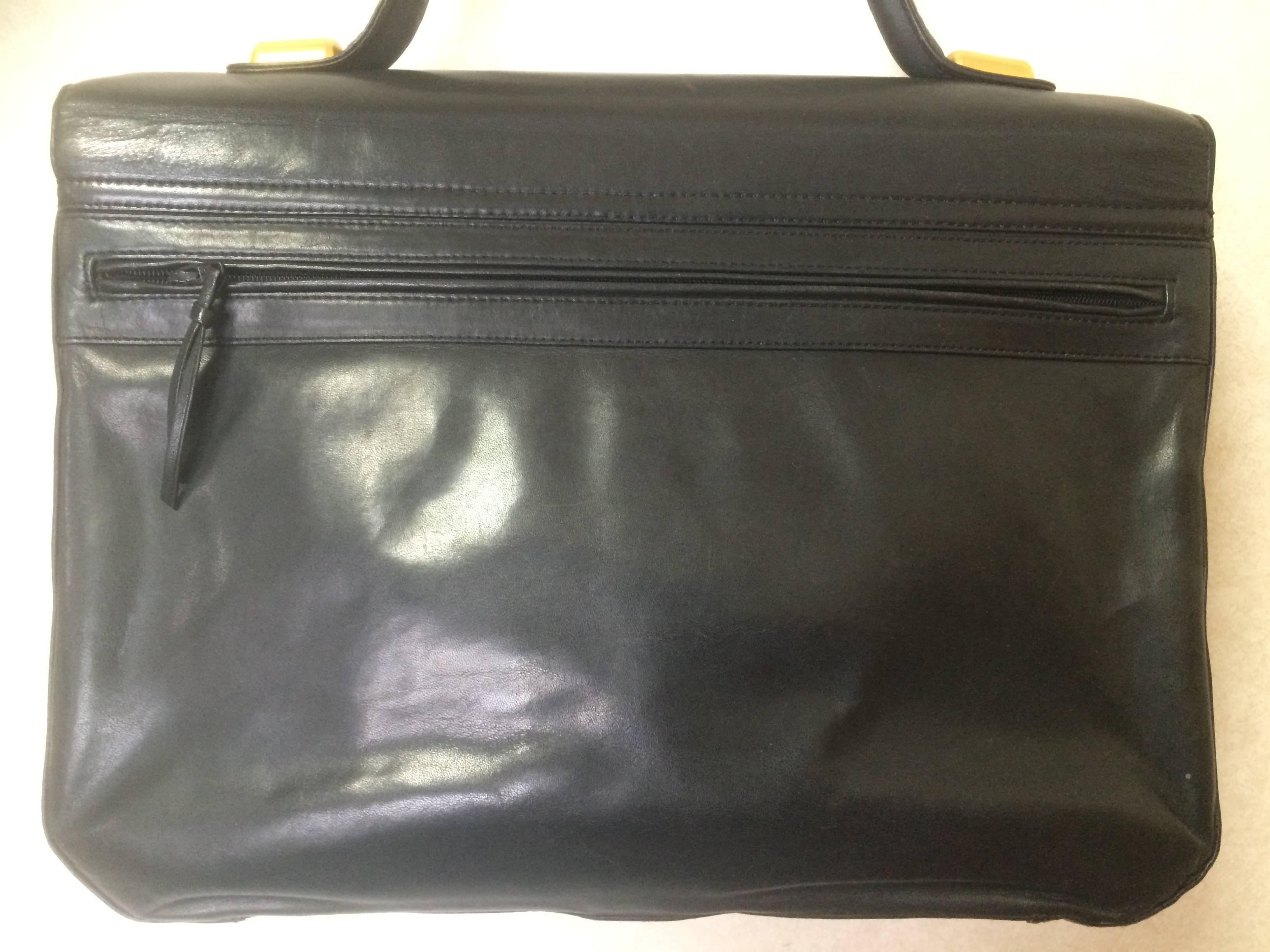 1980s. Vintage Bally black leather retro pop design bag, business purse with gold tone drawstrings and unique flap cut design.  Unisex use.

Introducing another very rare vintage piece from BALLY in the 80s...
One of the rarest pieces back in the